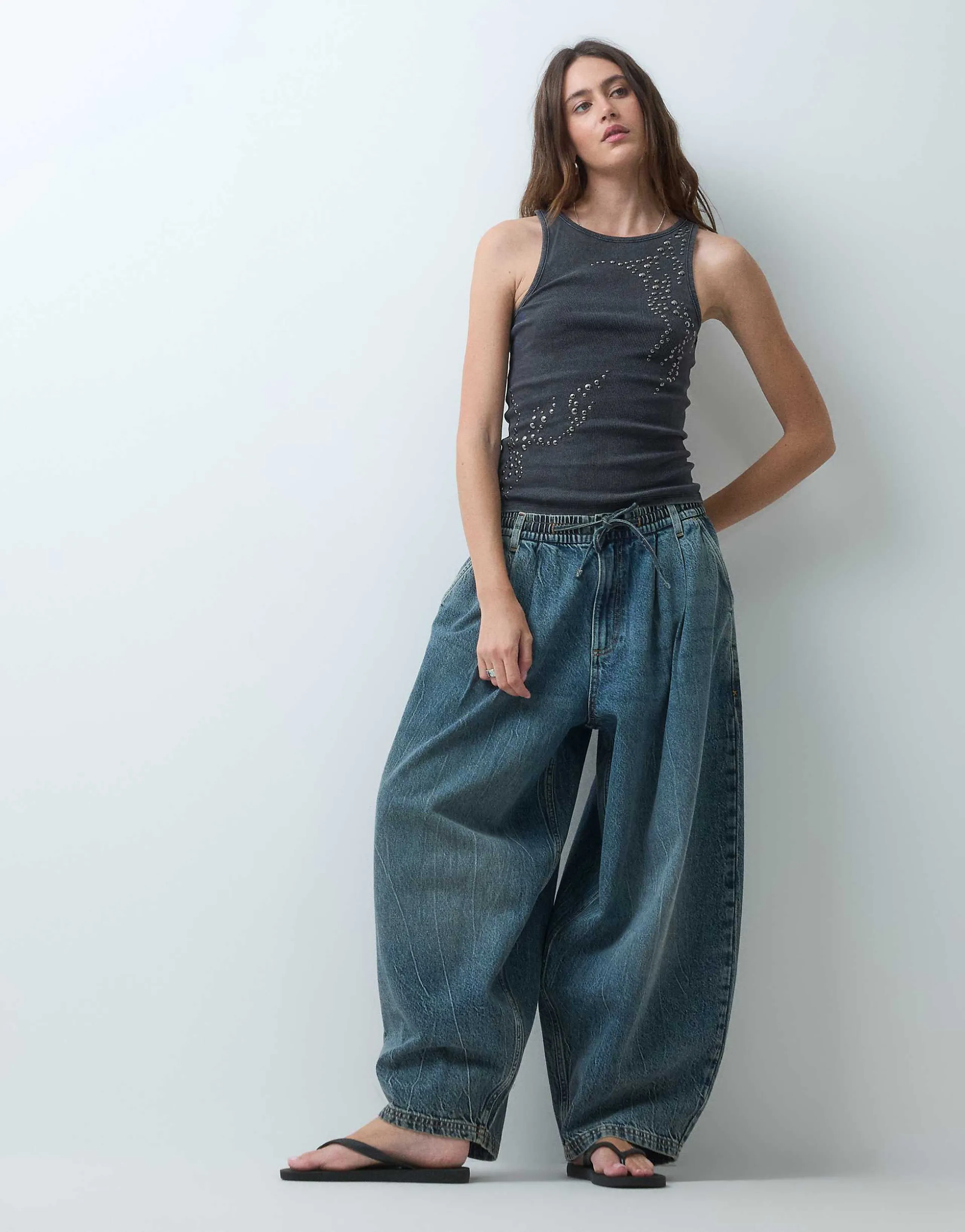 COLLUSION XL balloon pull on jeans in mid blue marble wash
