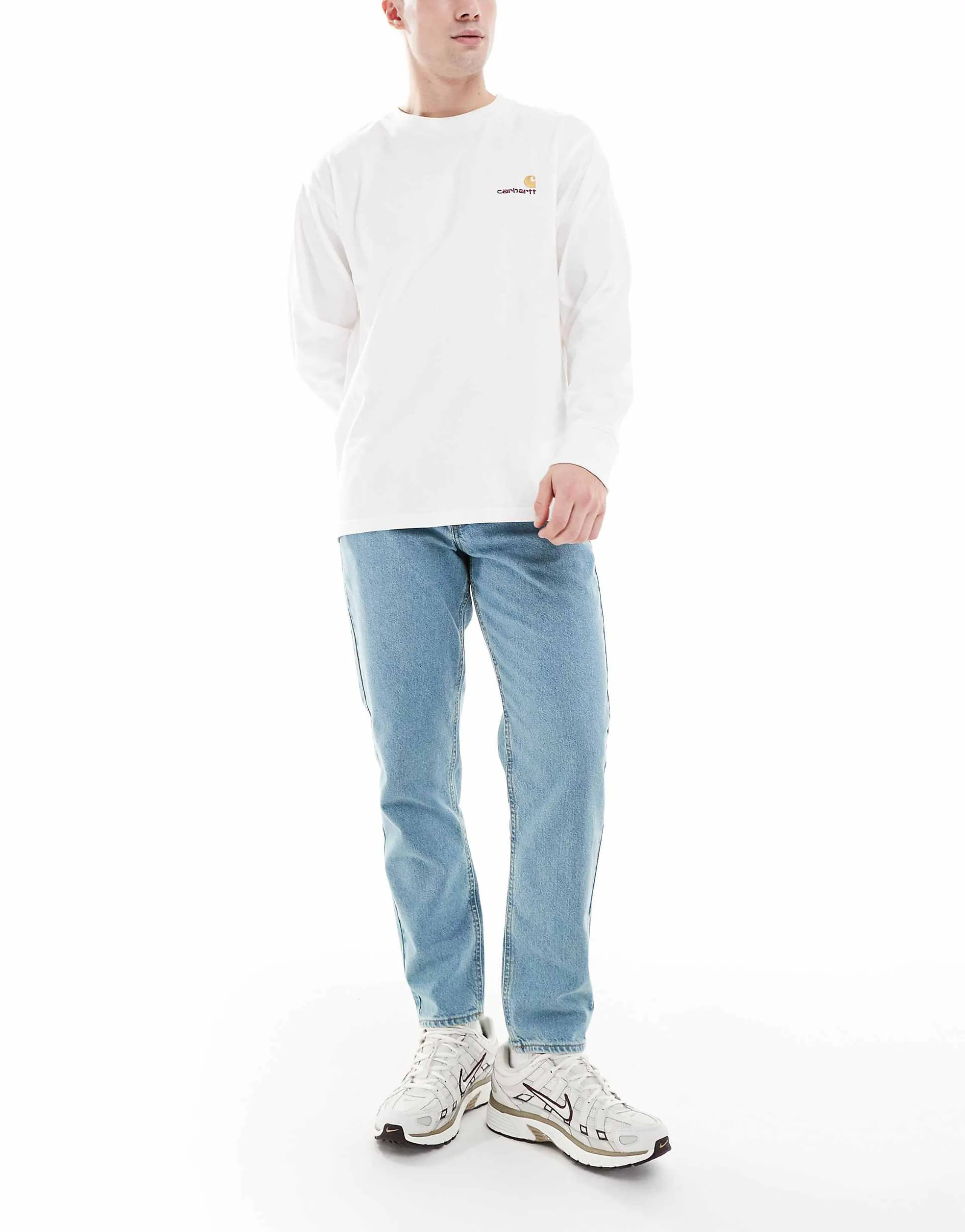 ASOS DESIGN tapered jeans in tinted light wash blue 