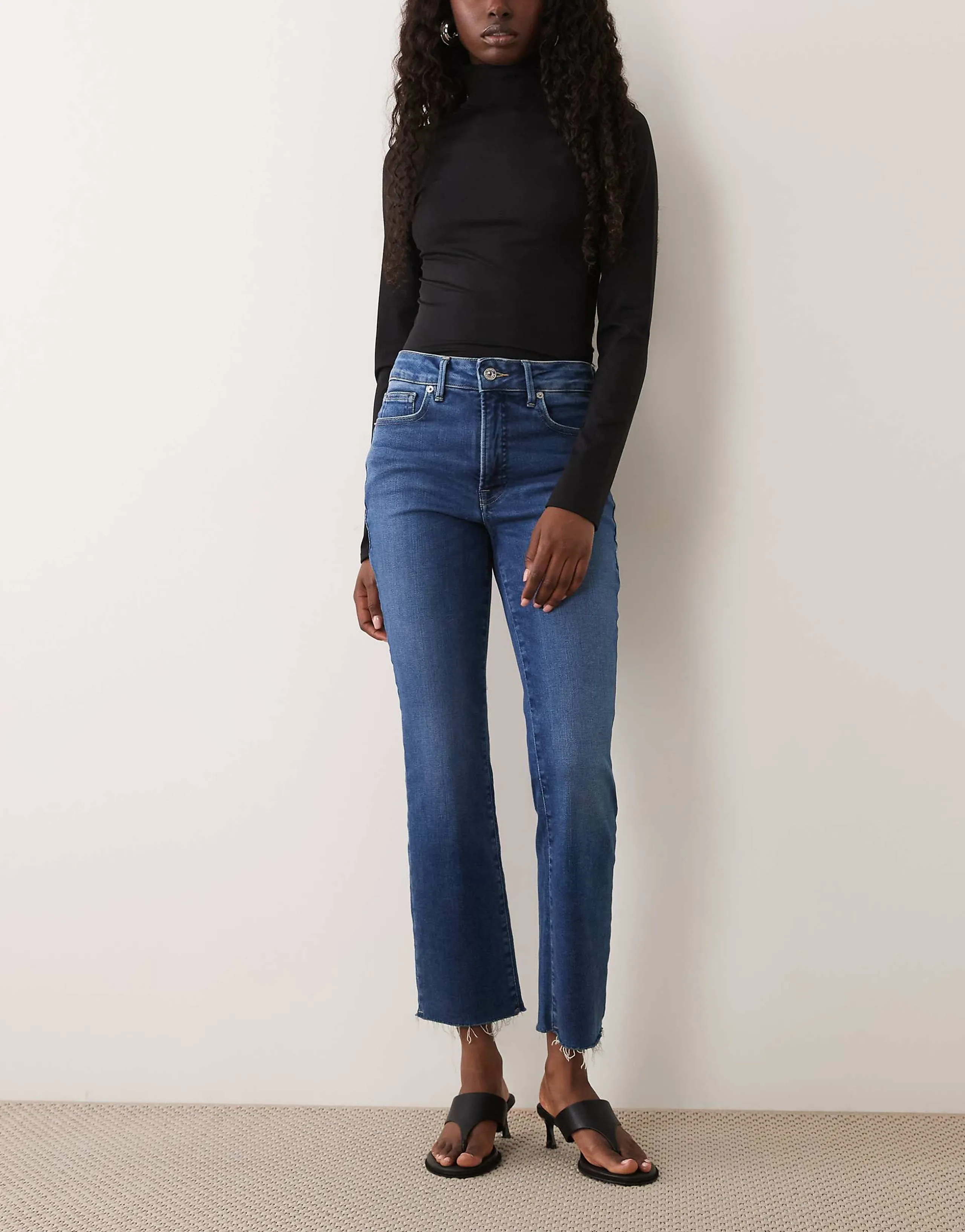 Good American soft tech good legs slim straight leg jeans in mid blue wash