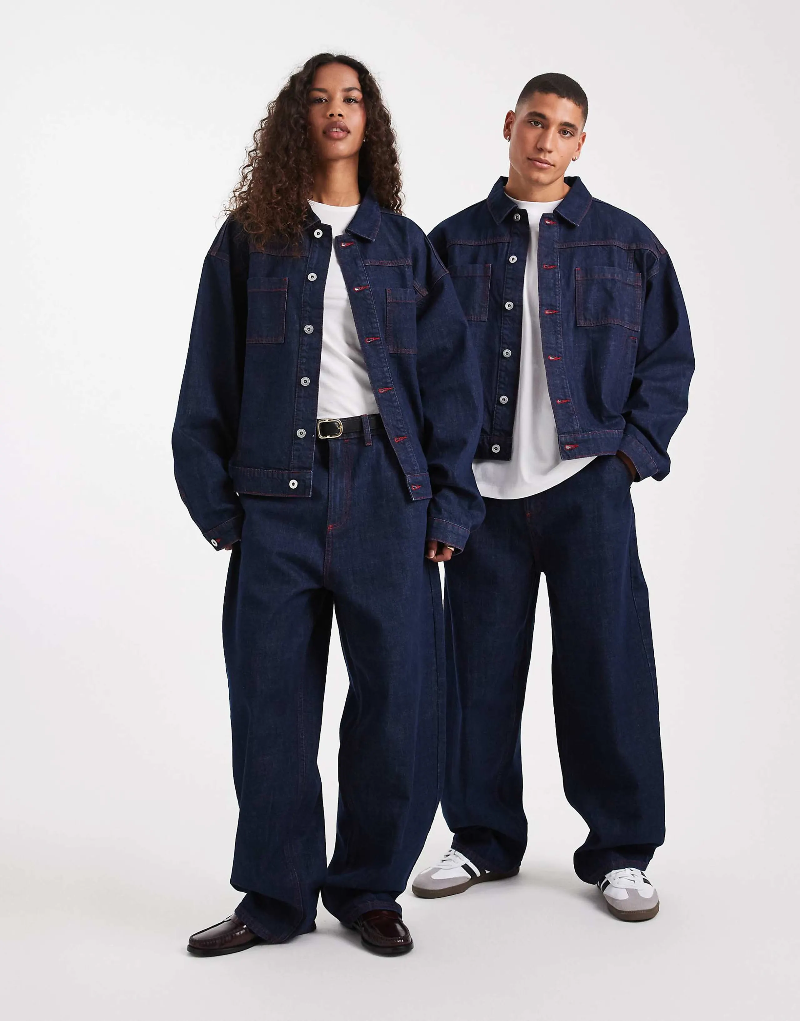 COLLUSION Unisex circular design collection antifit jeans in rinse with red topstitching