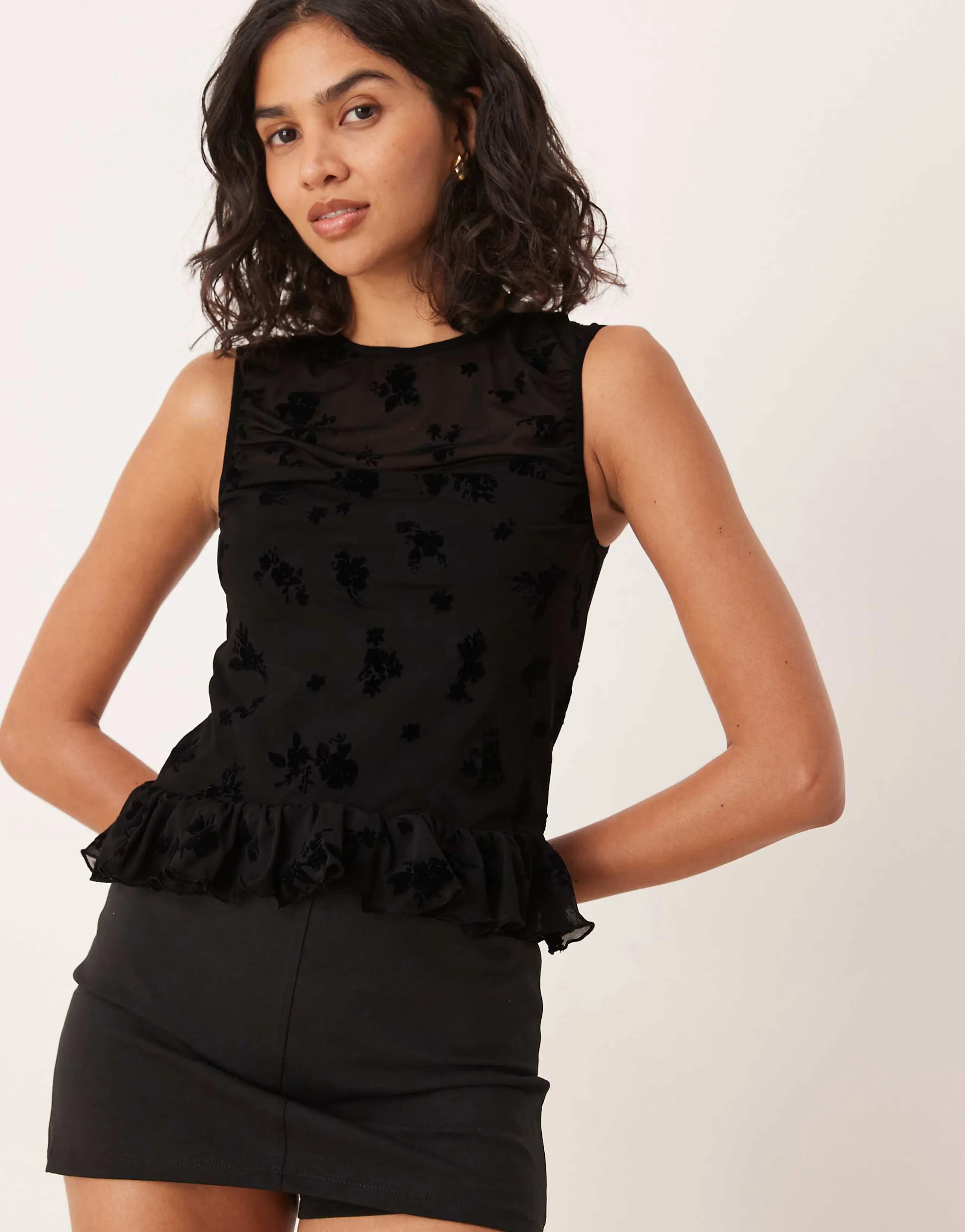ASOS DESIGN flocked mesh ruched top with peplum hem in black