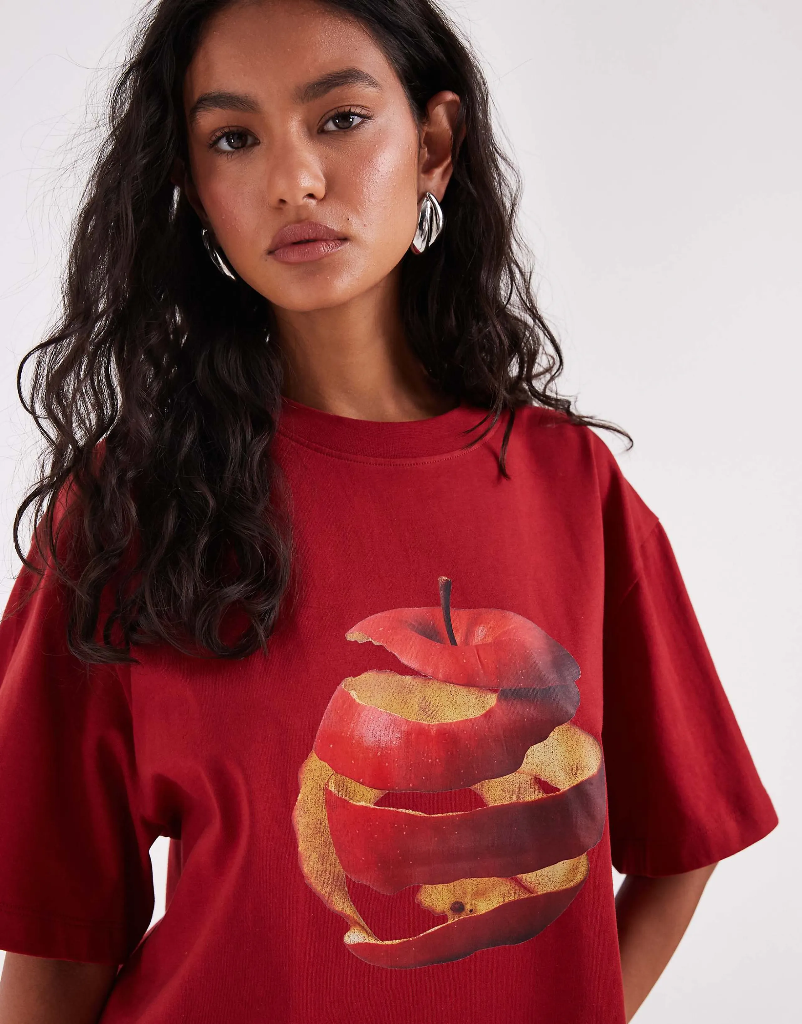 ASOS DESIGN Oversized T-shirt with spiral apple graphic in red
