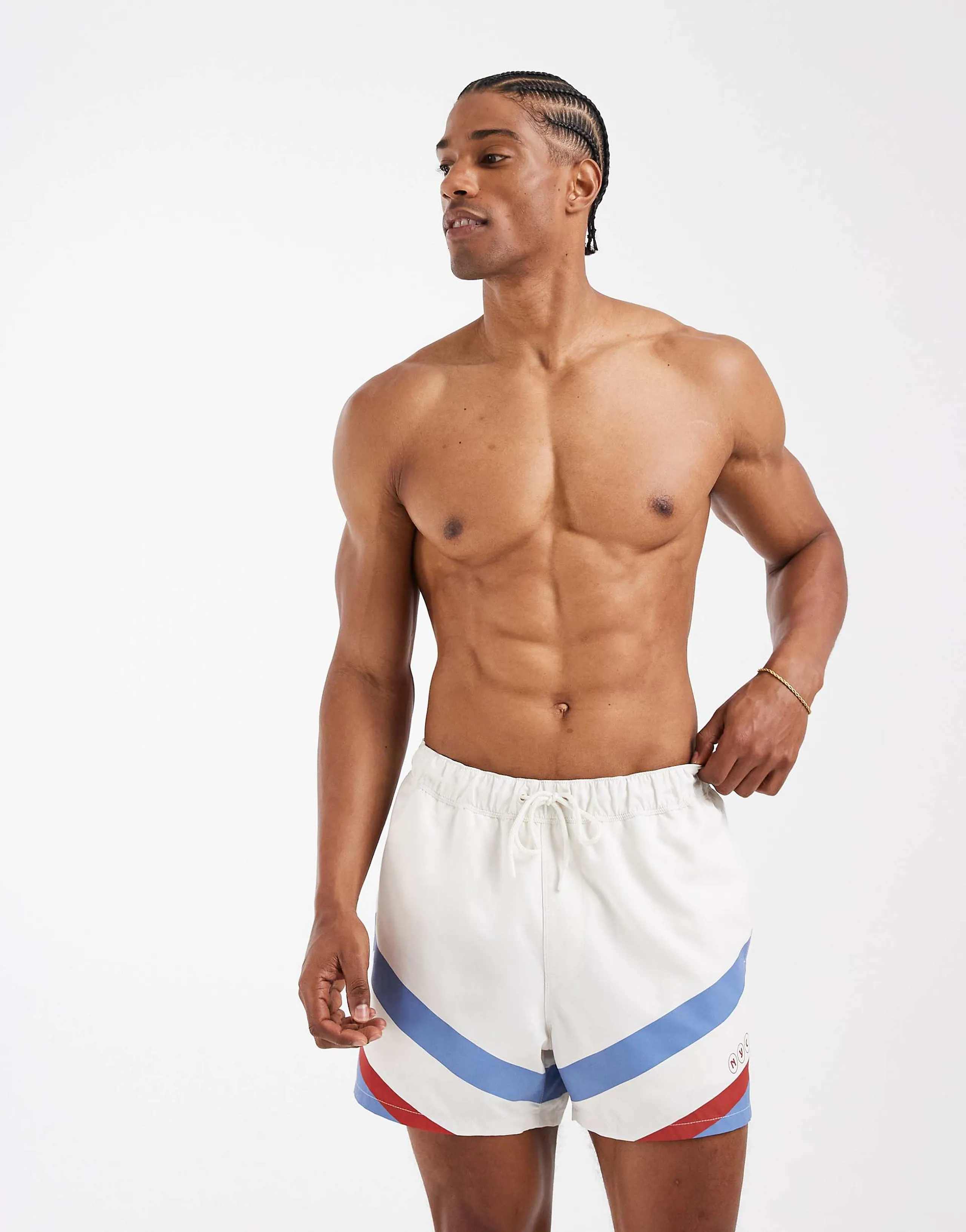 ASOS DESIGN swim shorts in short length with placement print in cream