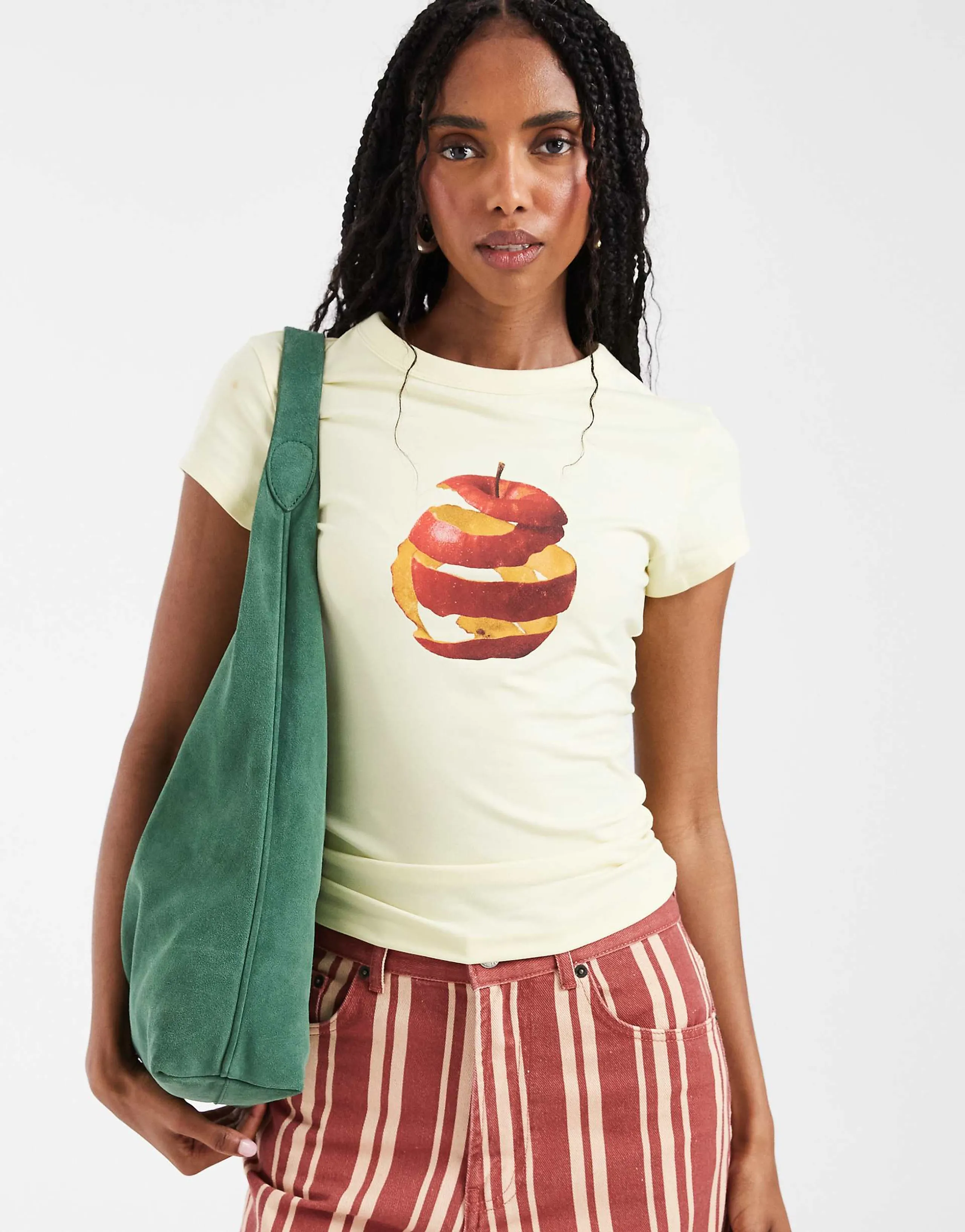 ASOS DESIGN Baby tee with spiral apple graphic in pale yellow