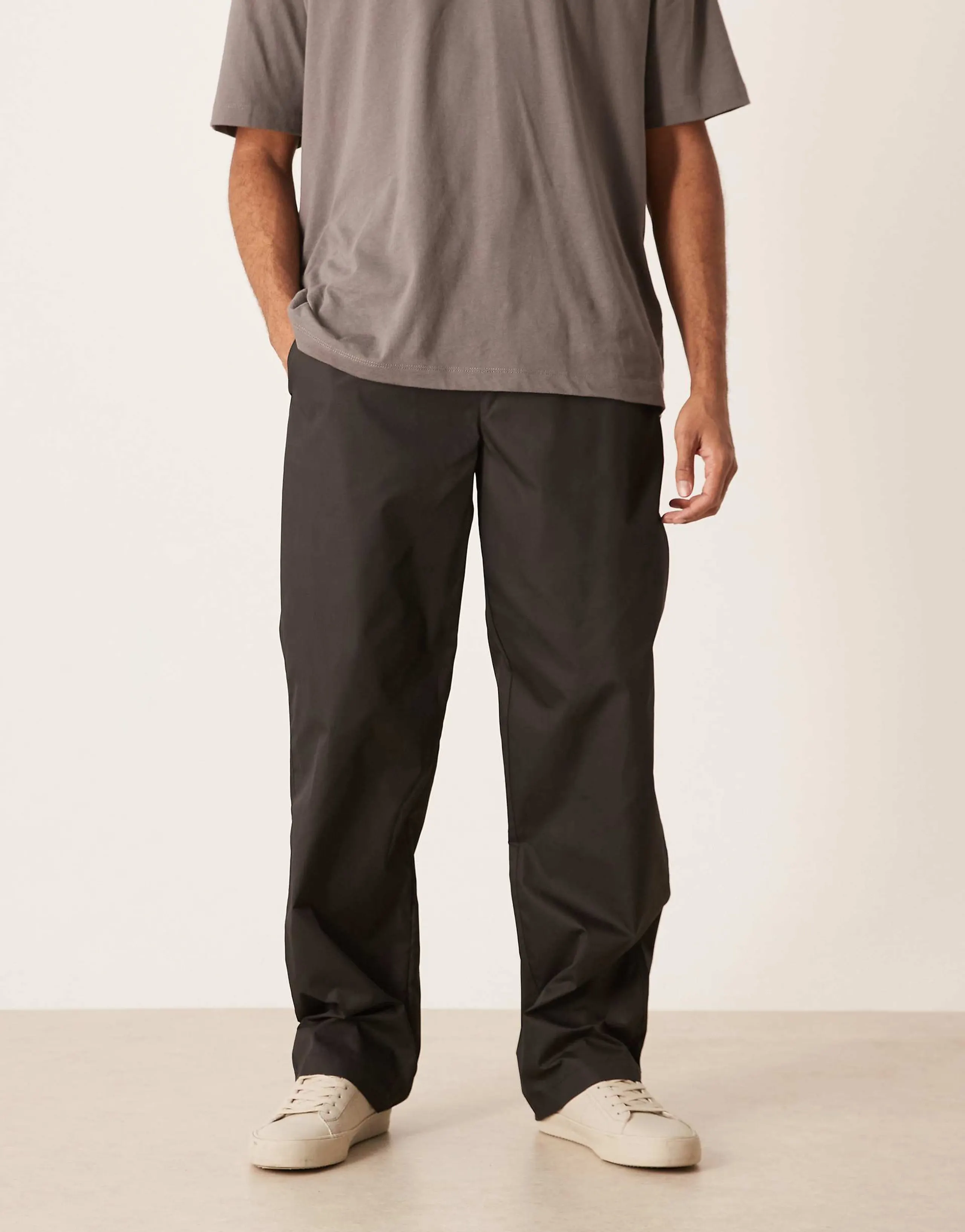 ASOS DESIGN baggy nylon pants in black with back pocket detail