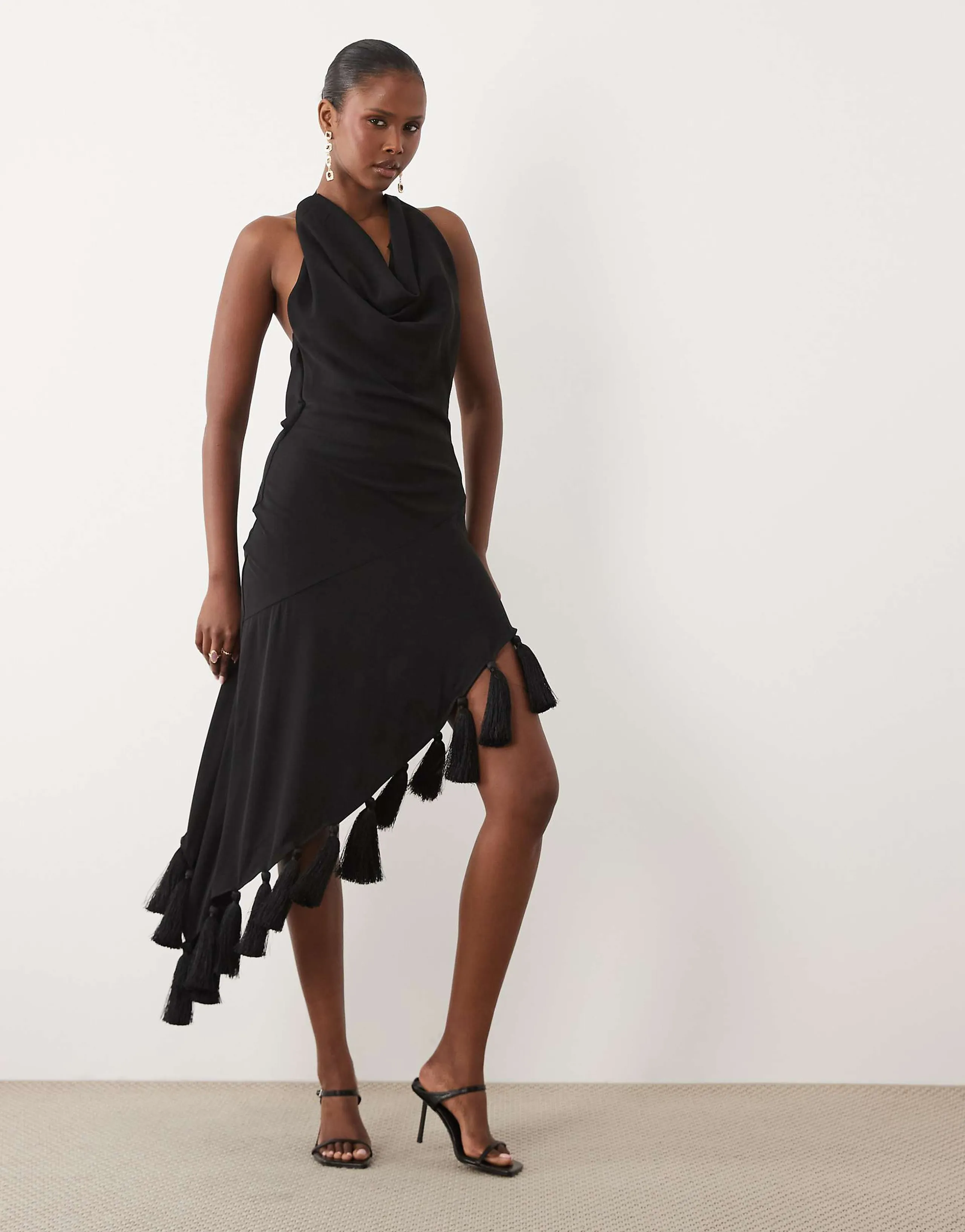 ASOS DESIGN halter neck asymmetric midi dress with tassel hem in black