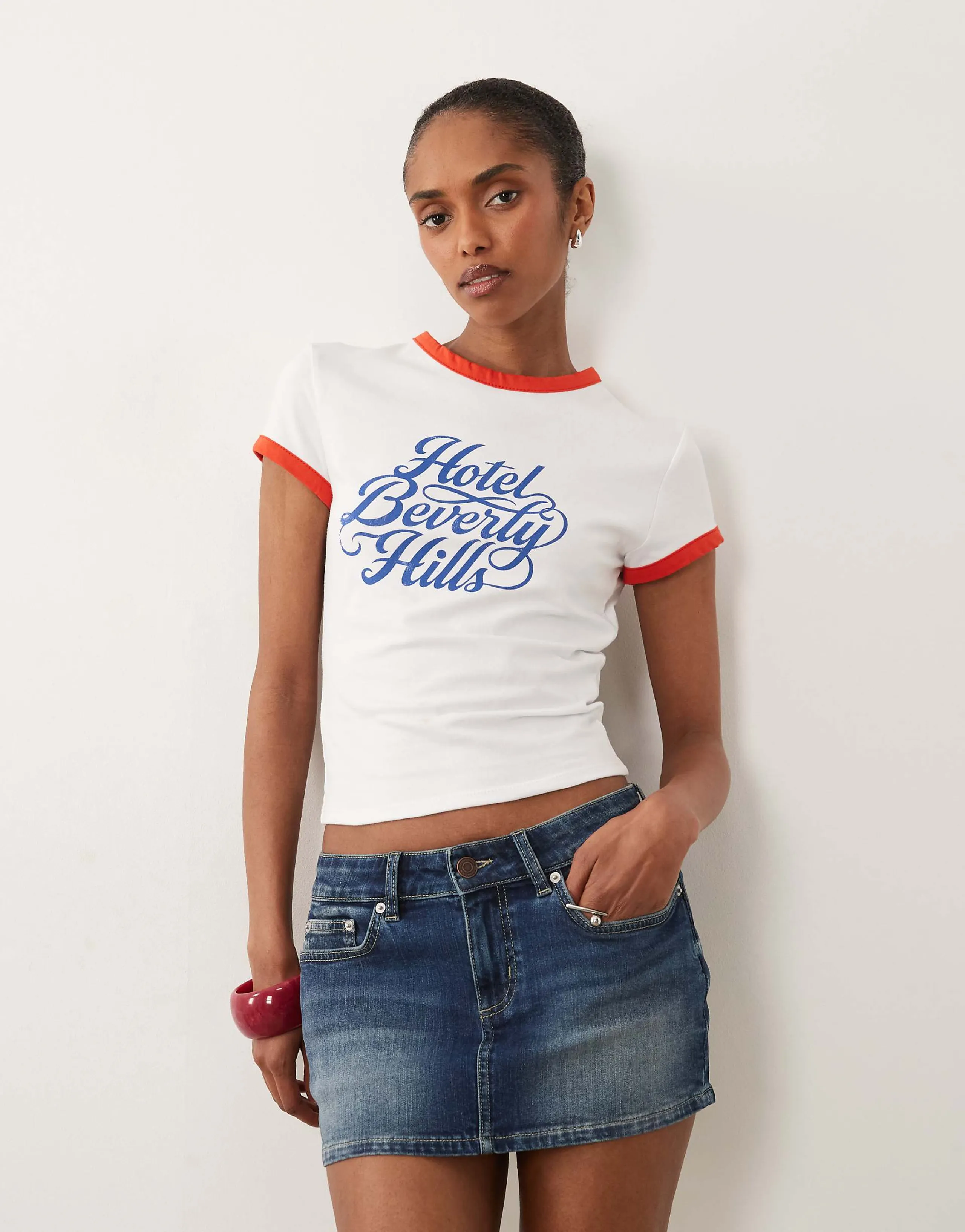 ASOS DESIGN Baby tee ringer with hotel graphic in white and red