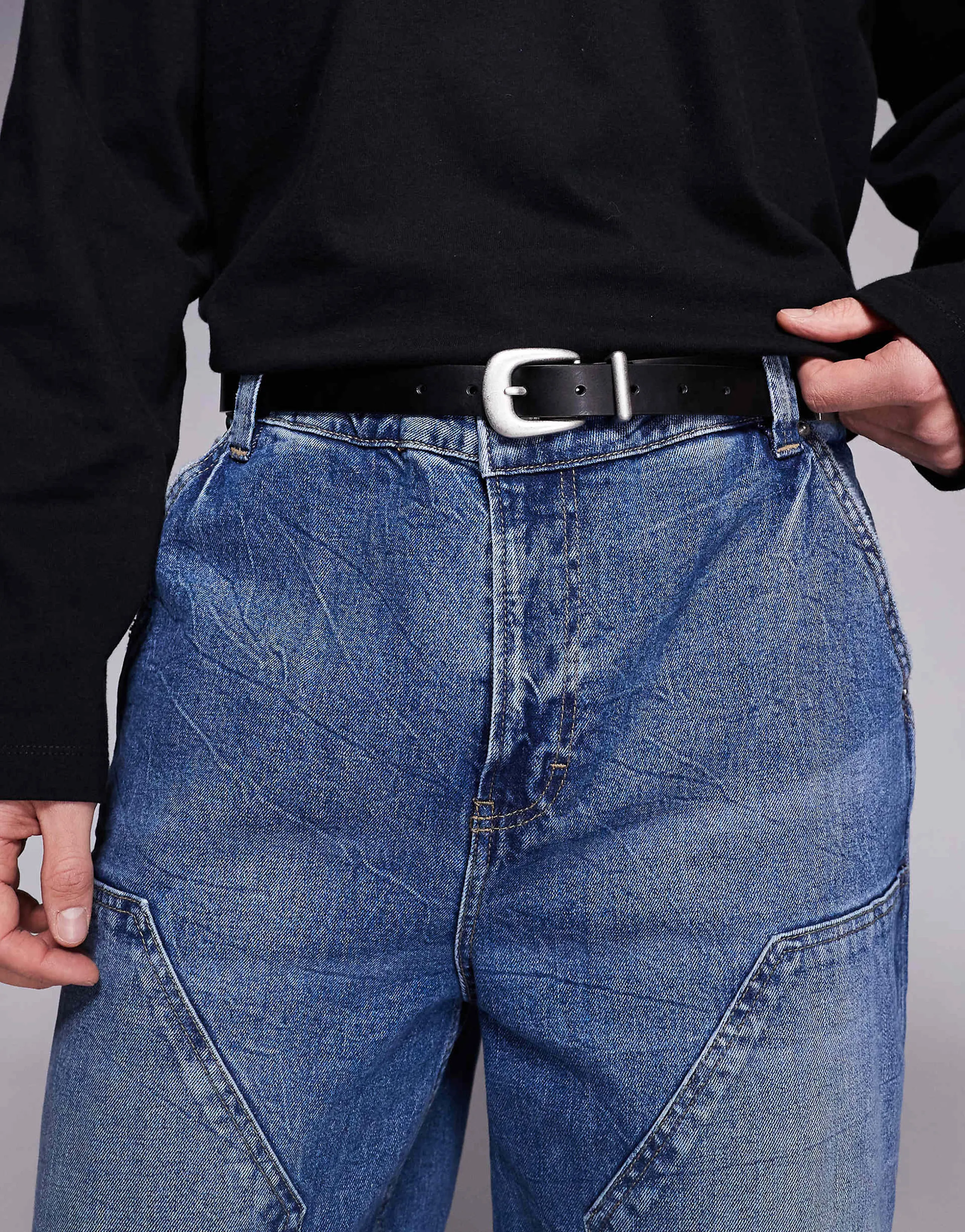 ASOS DESIGN faux leather skinny belt with curve buckle and metal tip in black
