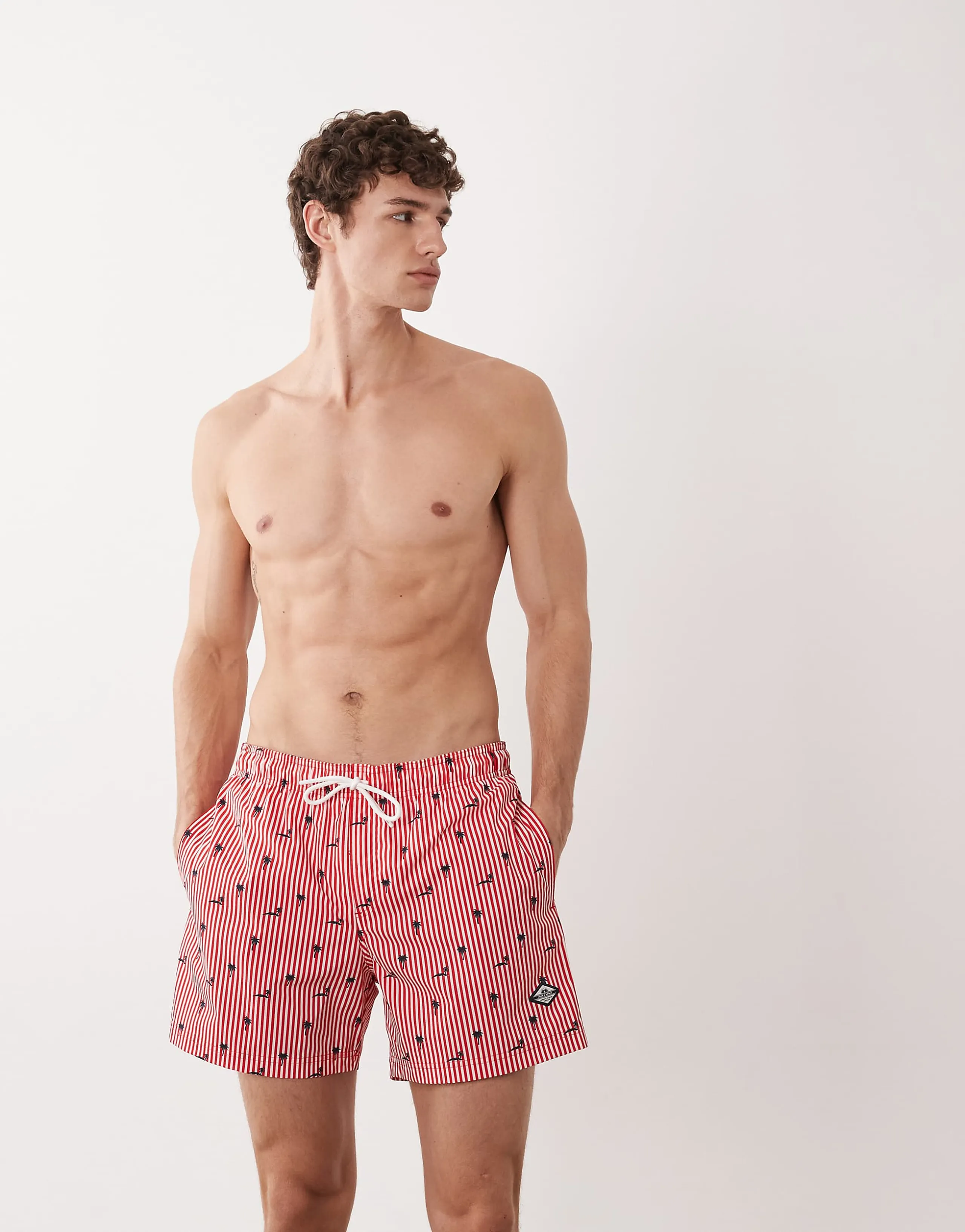 Jack & Jones palm tree print swim shorts in red stripe