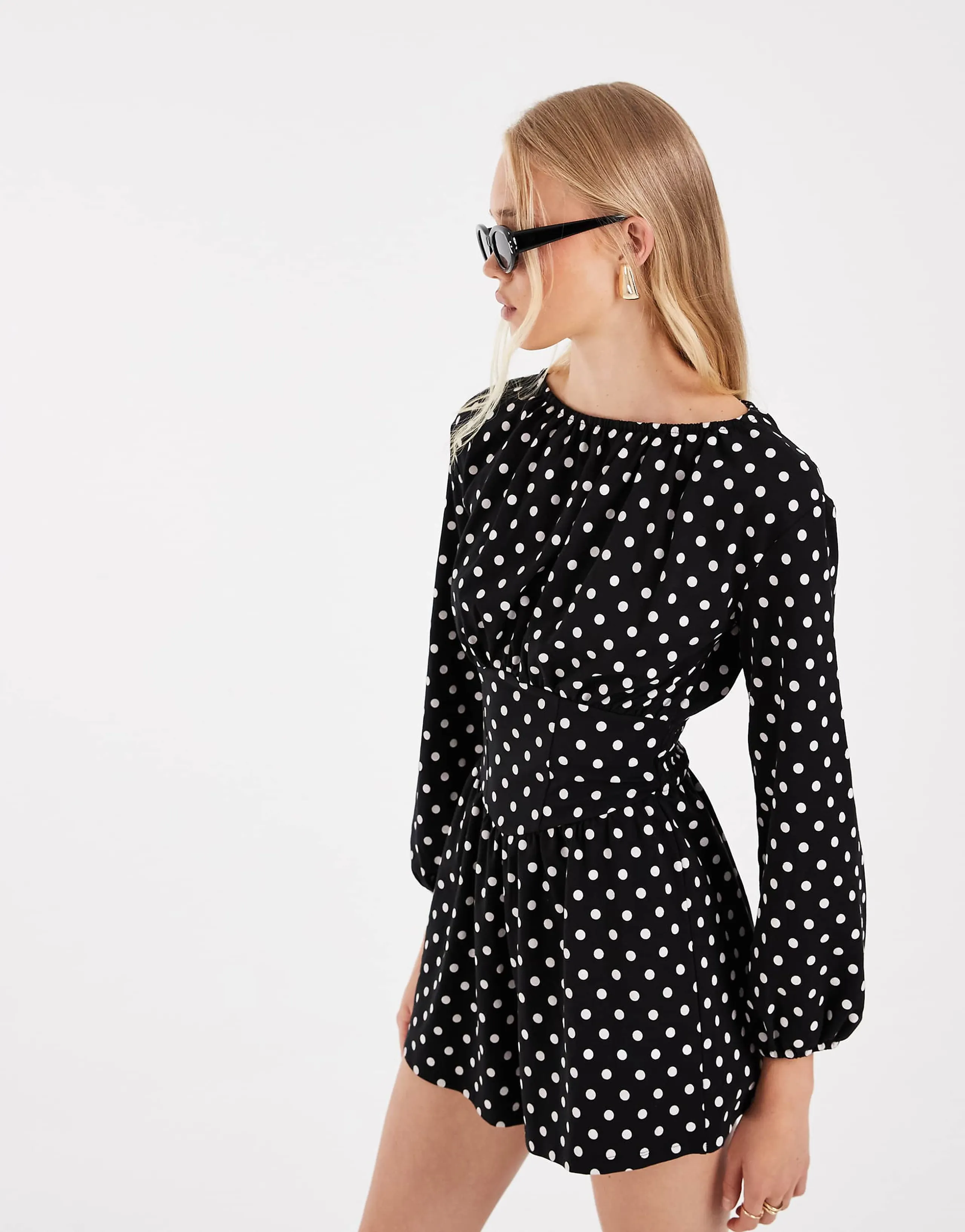 ASOS DESIGN polka dot cinched waist romper in black and white