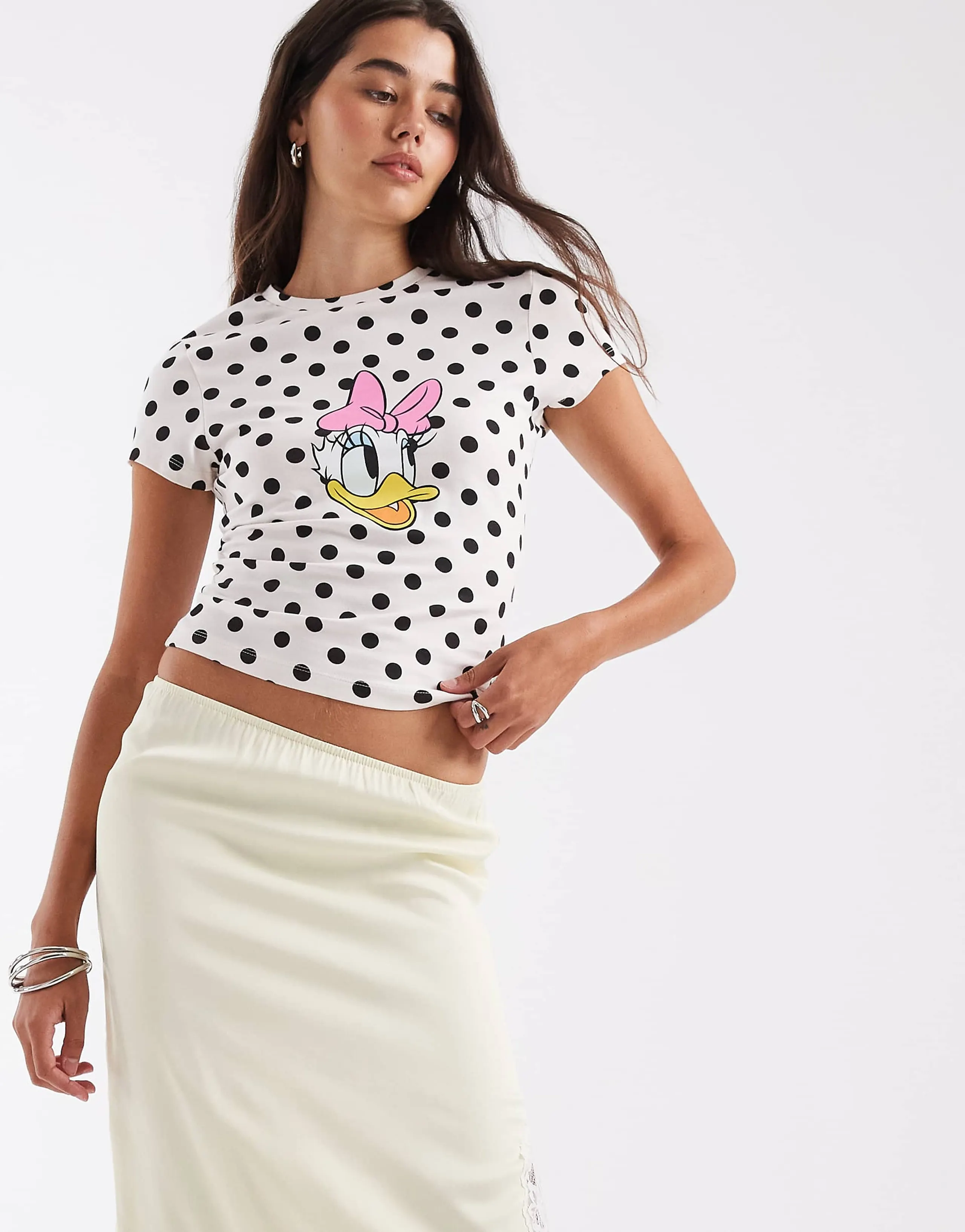 ASOS DESIGN Disney baby tee with Daisy Duck print in baby pink polka dot print