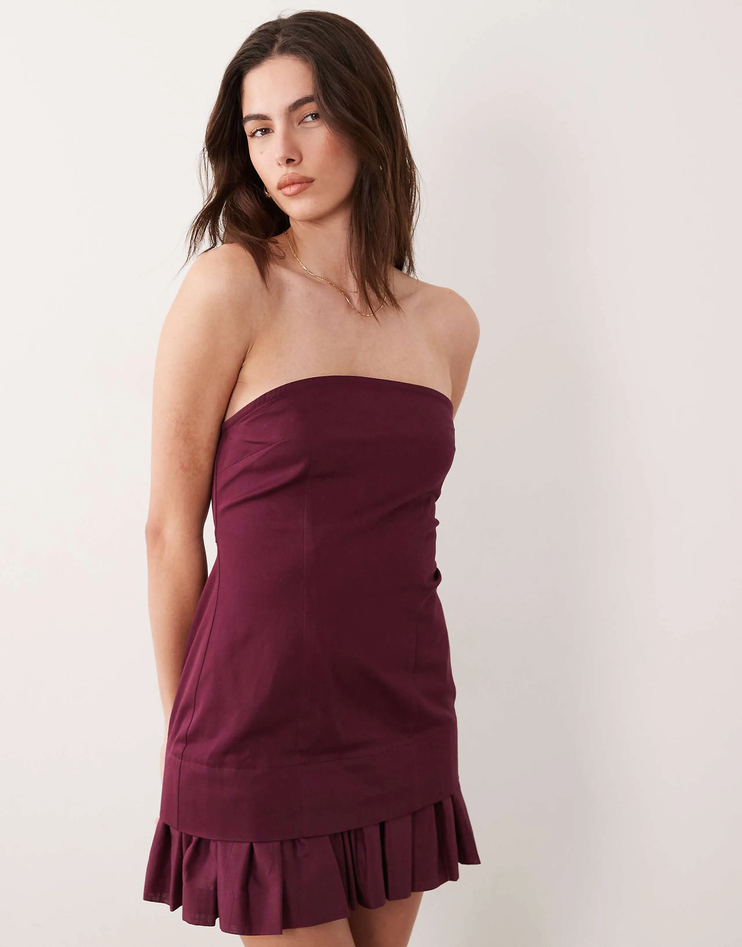 ASOS DESIGN structured cotton blend strapless mini sundress with ruffle hem in plum