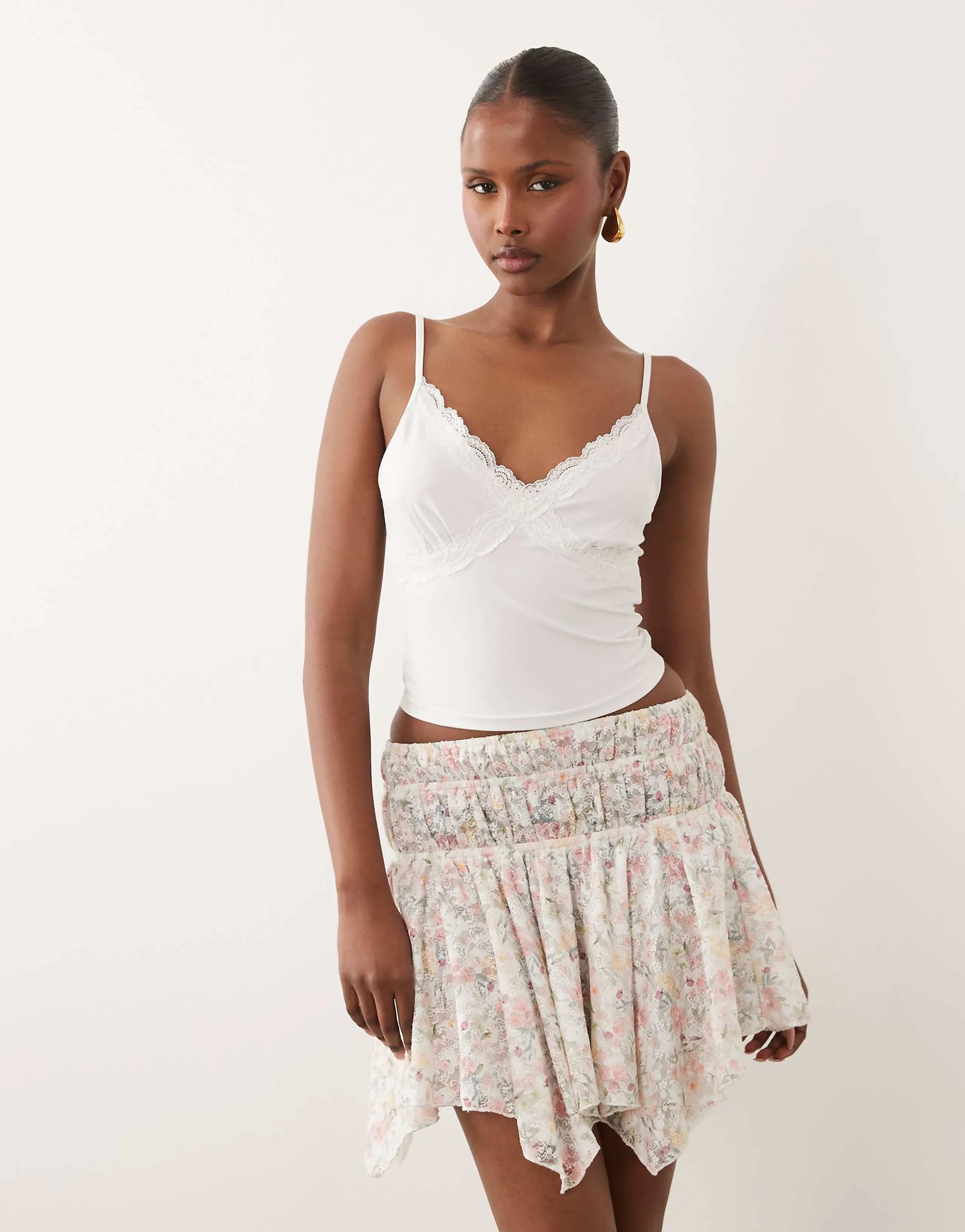 ASOS DESIGN asymmetric lace layered mini skirt in pink floral