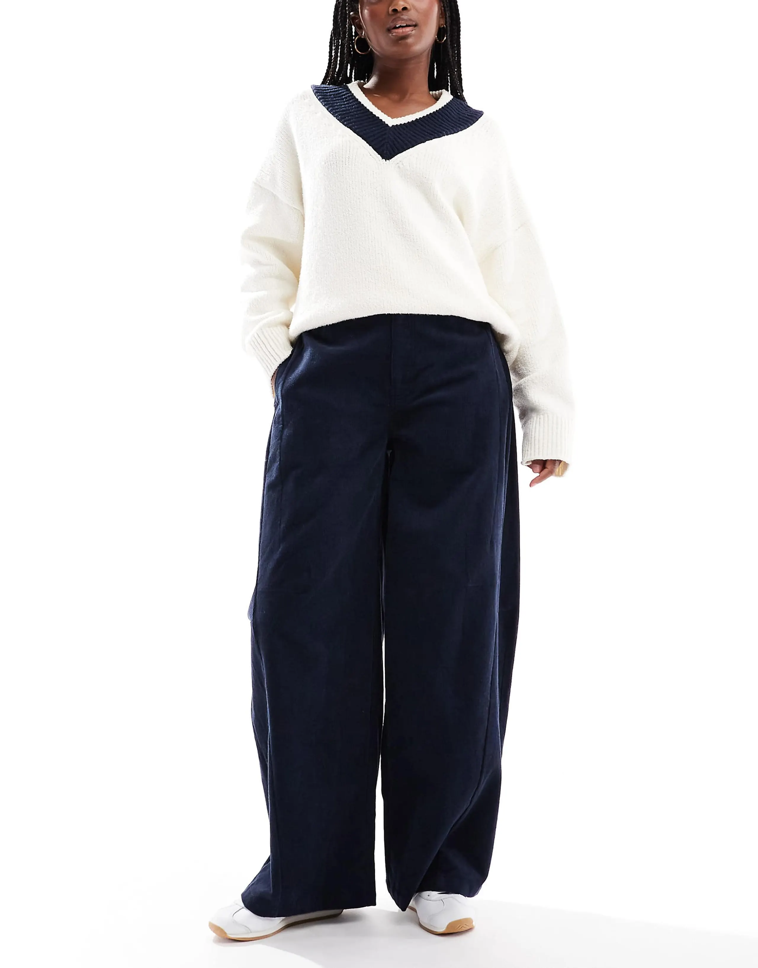ASOS DESIGN baby cord extreme horseshoe pants with seam detail in navy