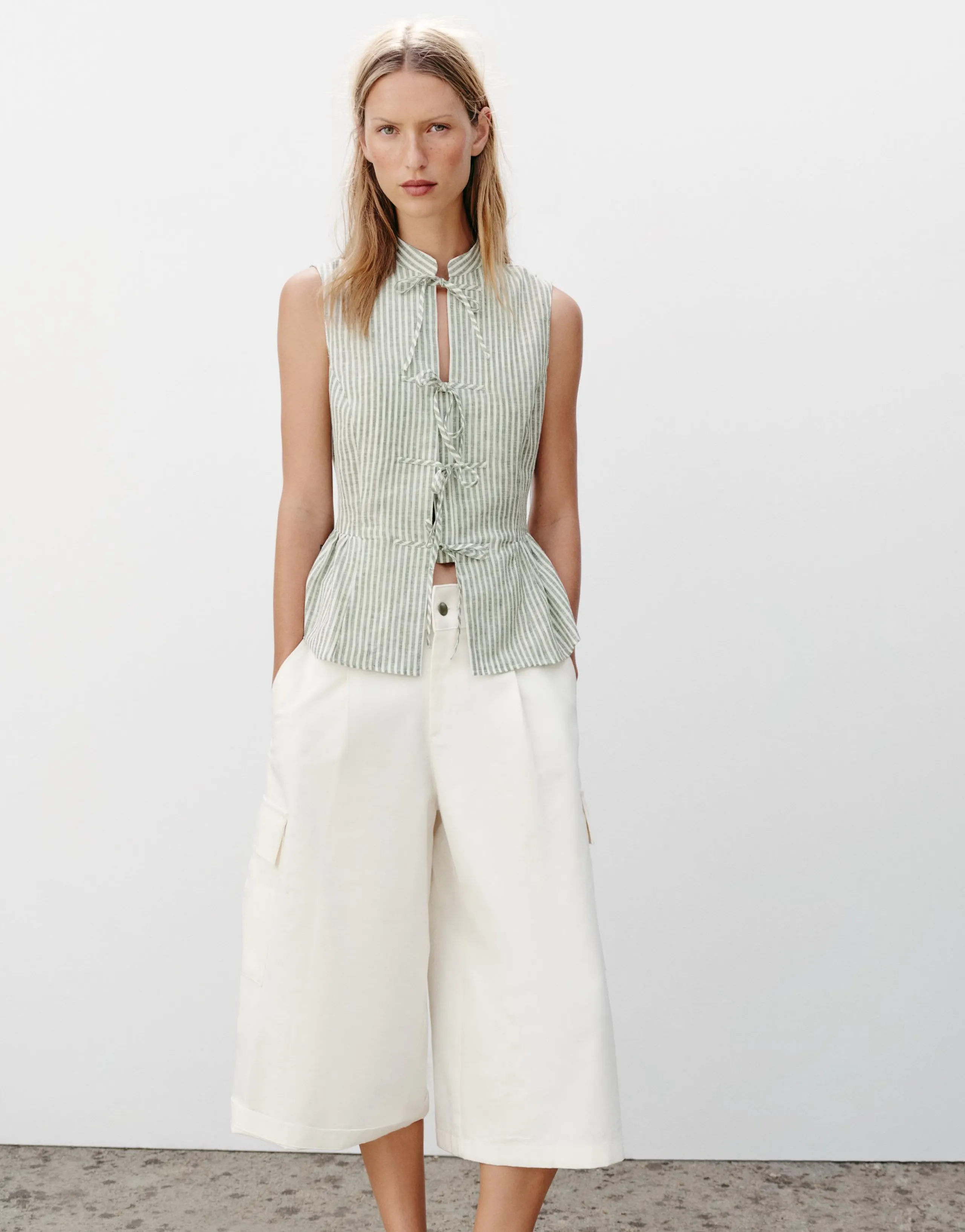 STRIPED TOP WITH METALLIC THREAD BOWS