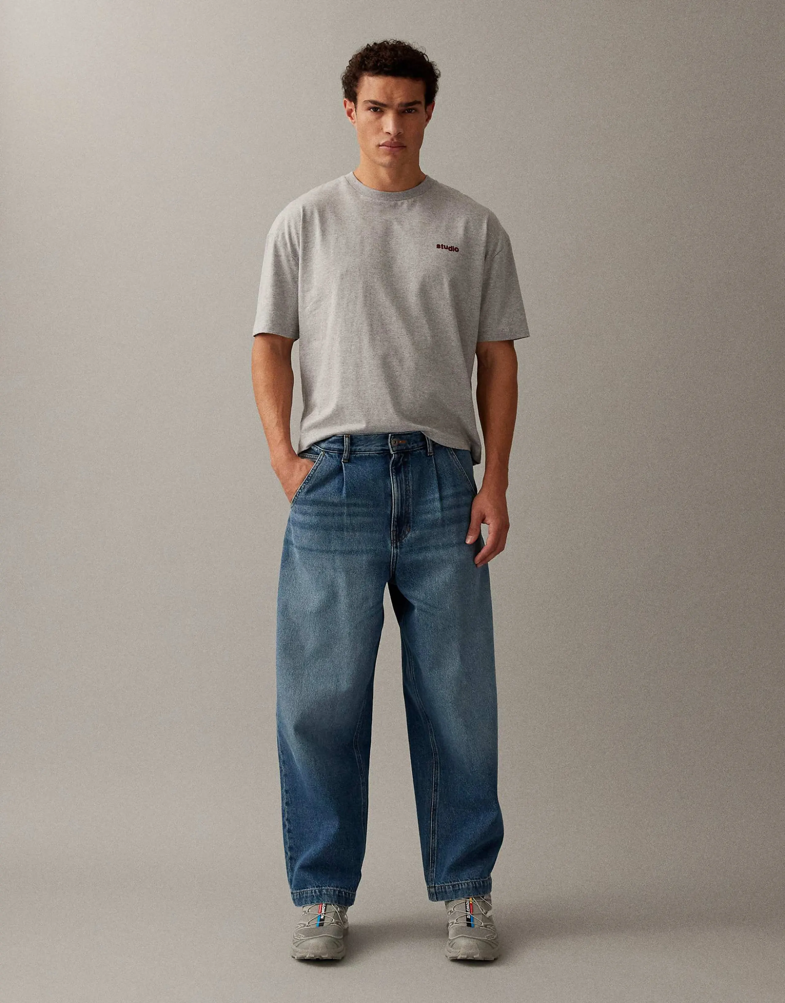 ASOS DESIGN relaxed tapered jeans in mid wash blue with pleats