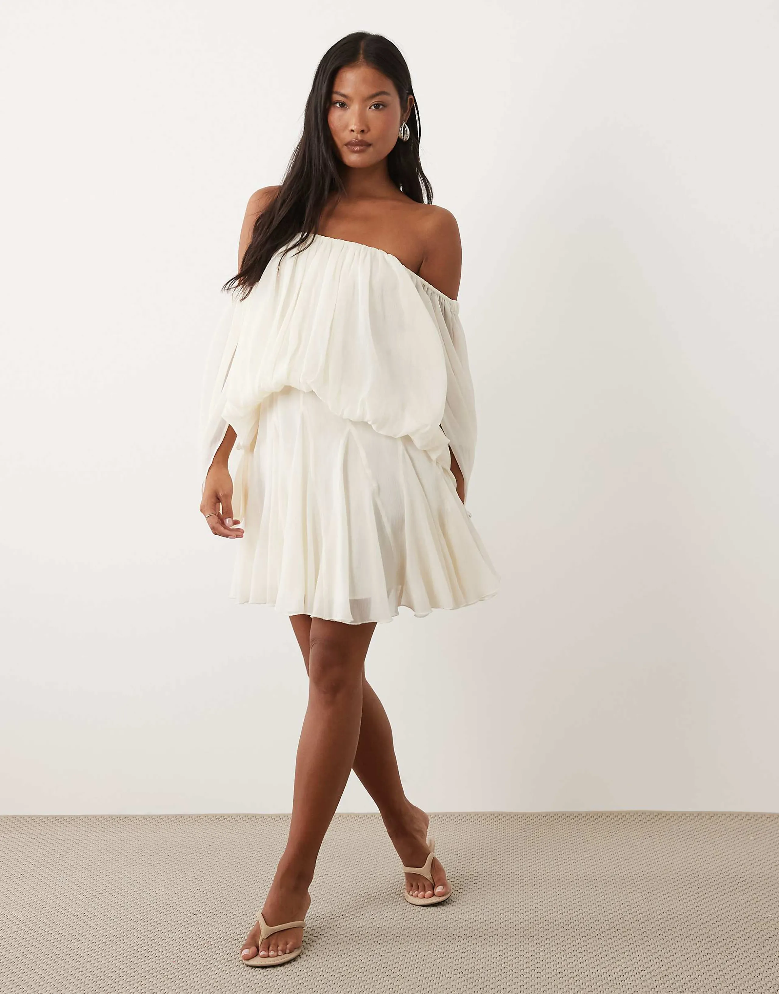 ASOS DESIGN Petite blouson mini dress with split sleeve and volume godet skirt in cream
