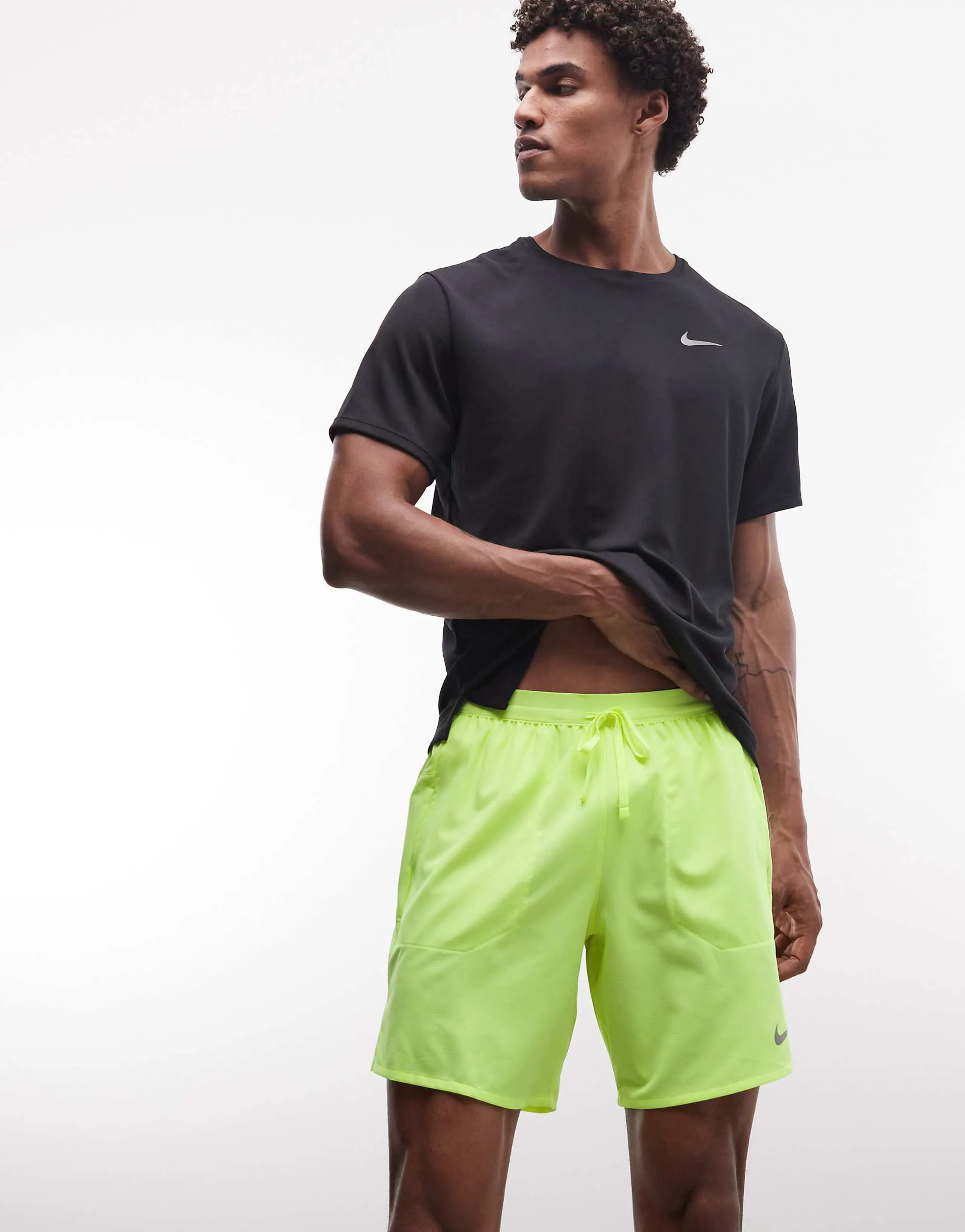 Nike Running Dri-Fit 7-inch shorts in lime green 