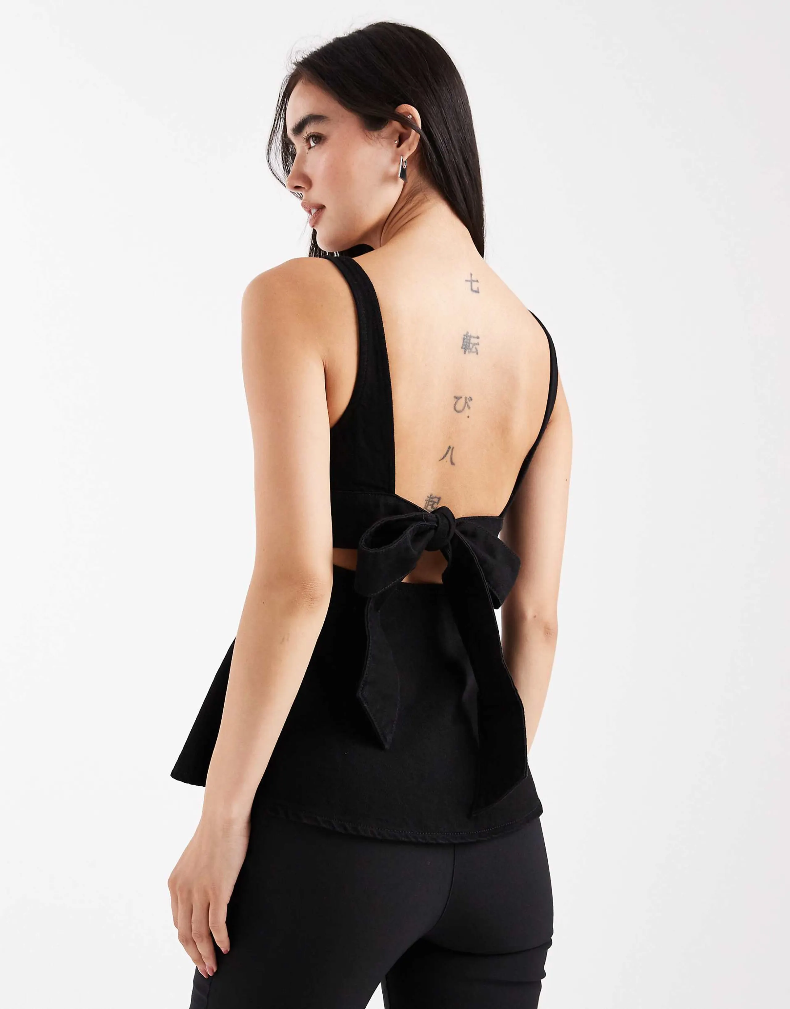 ASOS DESIGN denim peplum top with bow back detail in washed black