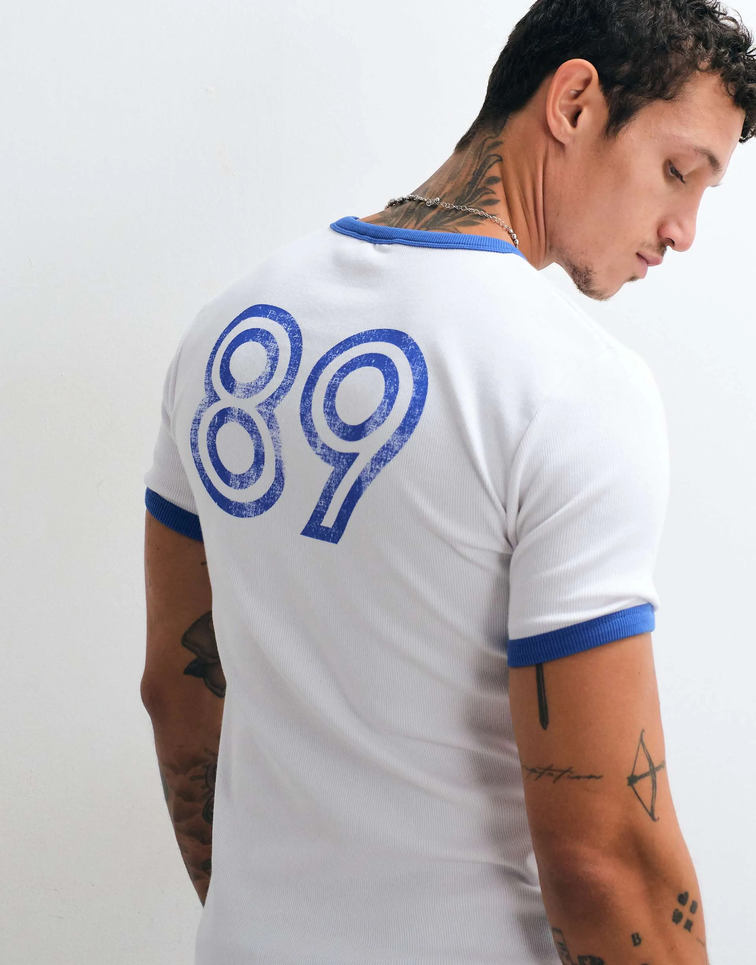 ASOS DESIGN heavyweight muscle fit ringer t-shirt with athletic graphics in white rib knit