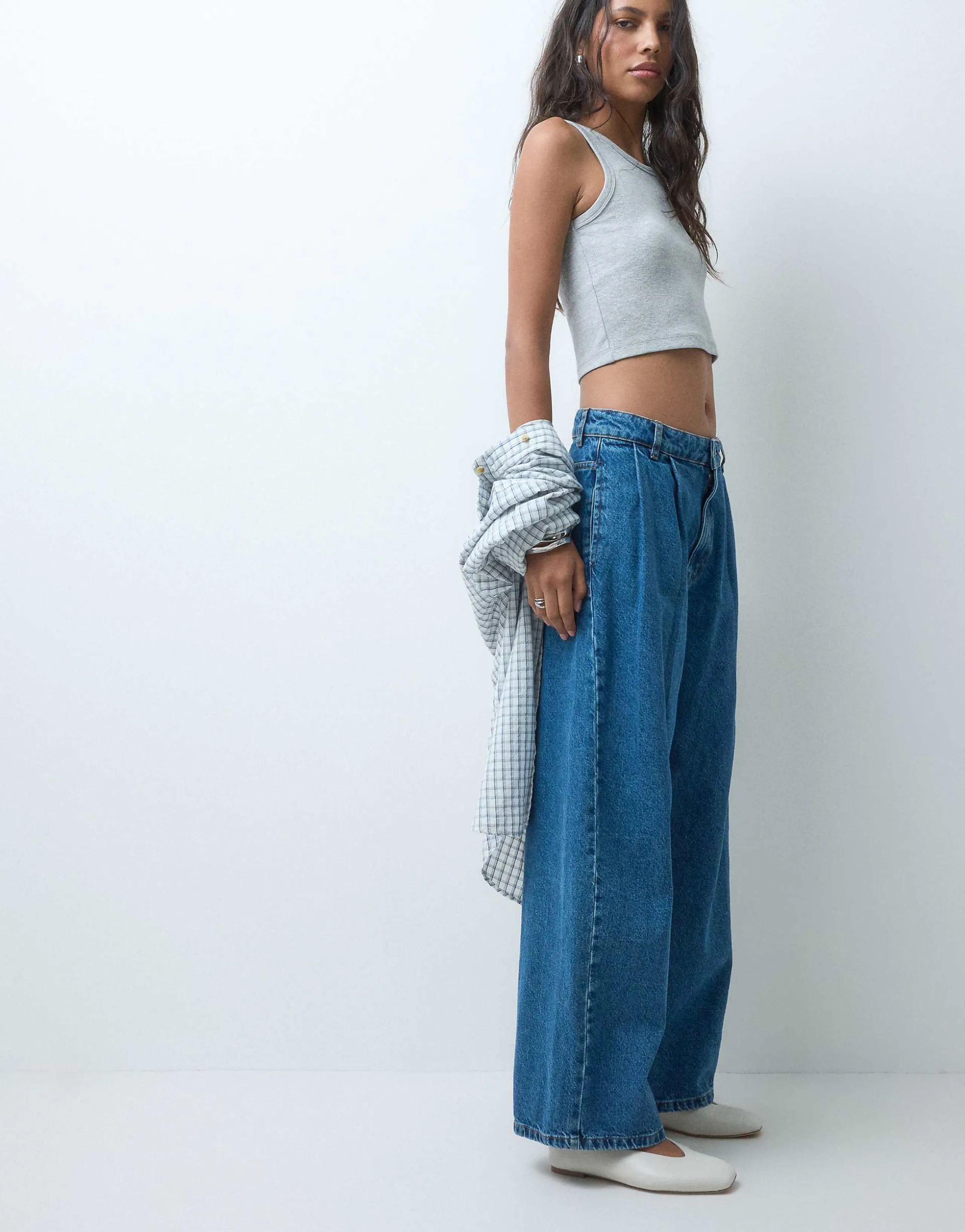 ASOS DESIGN pleat front horseshoe jeans in mid wash blue