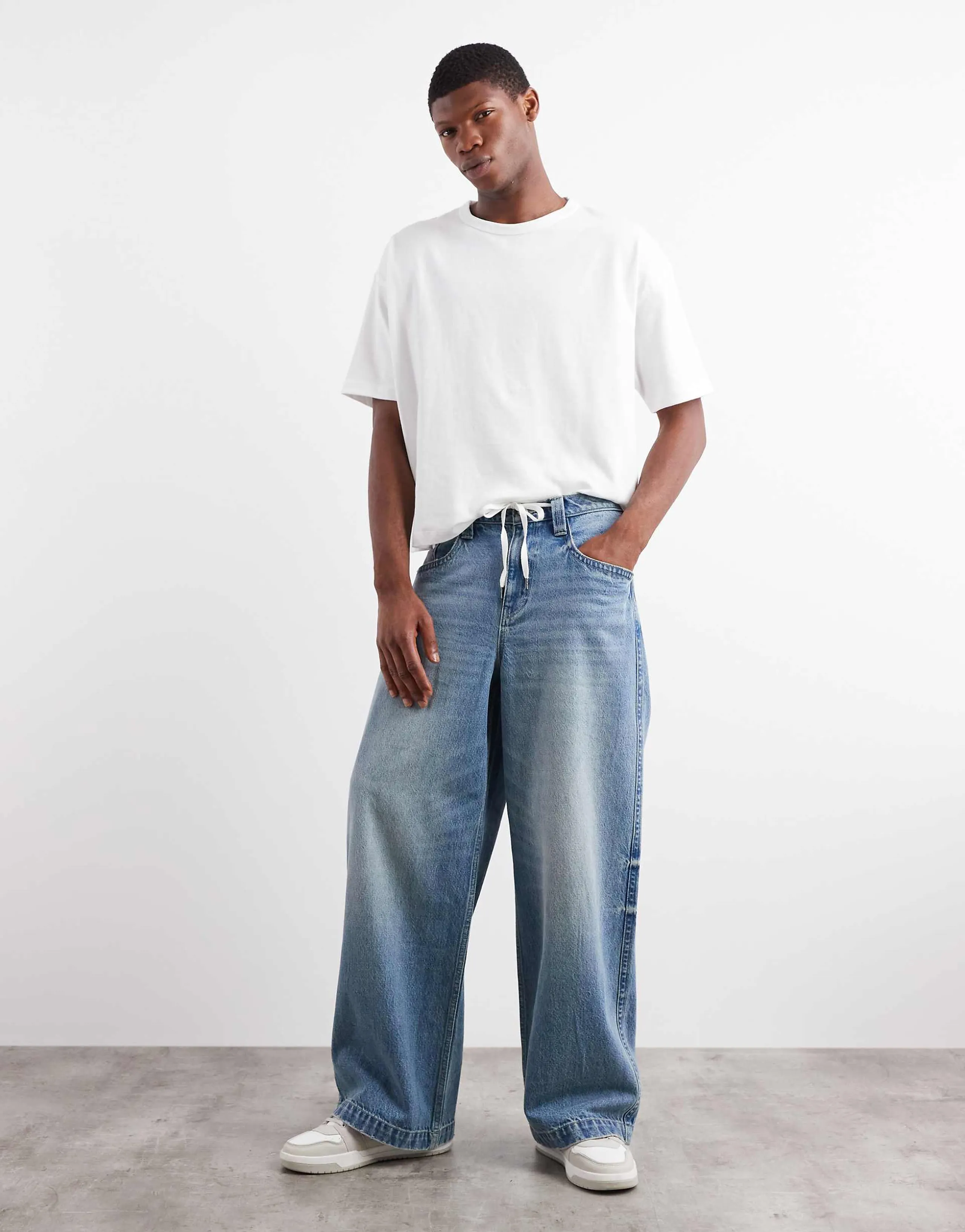 ASOS DESIGN extreme baggy fit jeans with embroidered back pocket in light wash blue 