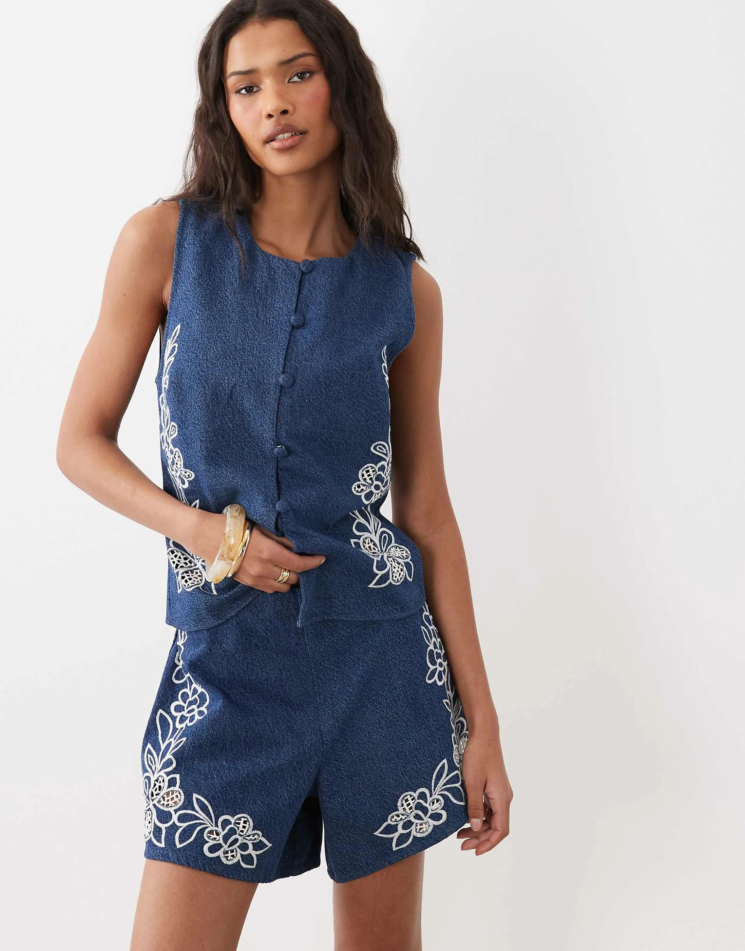ASOS DESIGN denim shorts with cutwork detail in mid blue