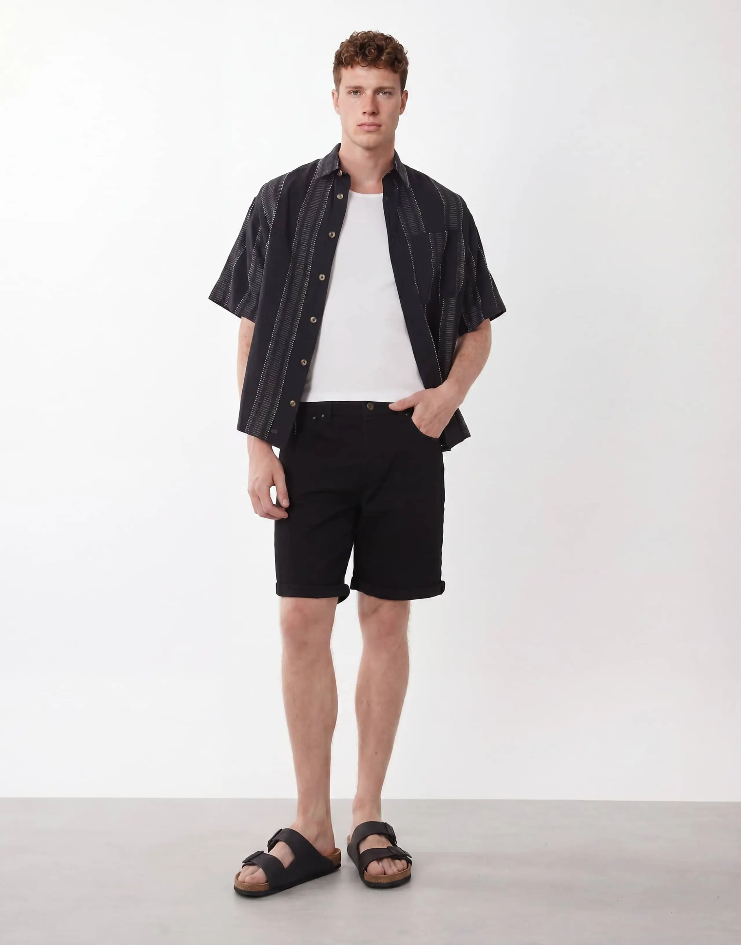 ASOS DESIGN stretch slim regular length denim shorts in black