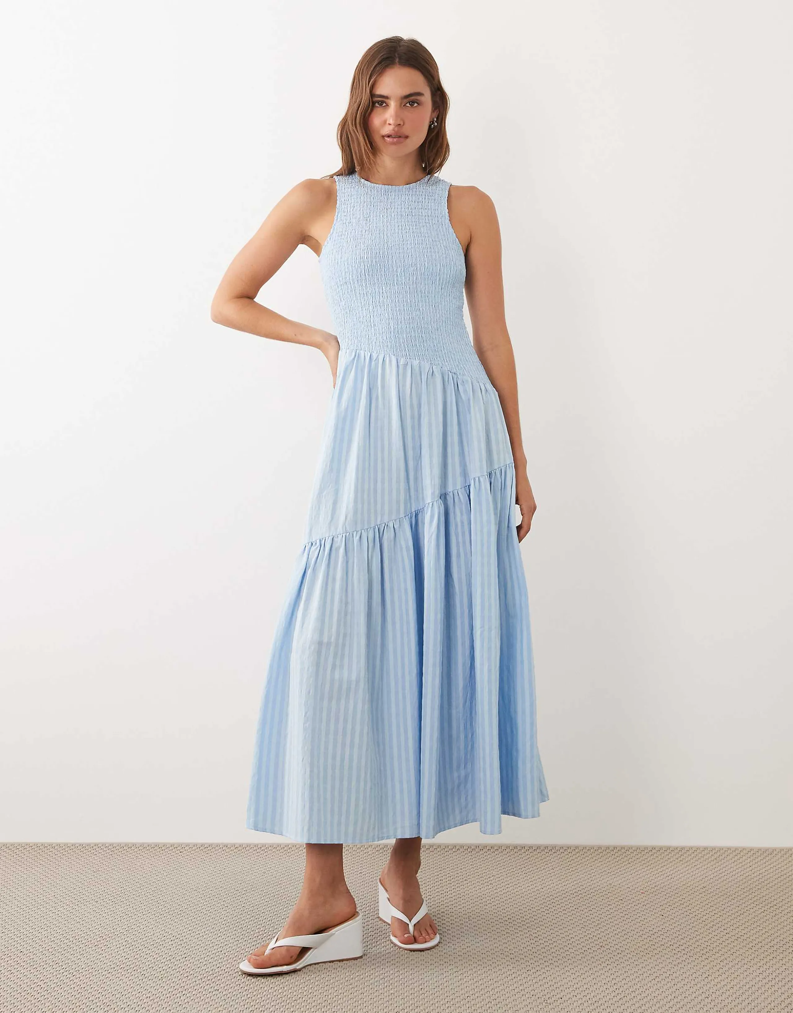 Ghospell sleeveless shirred bodice asymmetric detail tiered skirt midi dress in light blue pinstripe