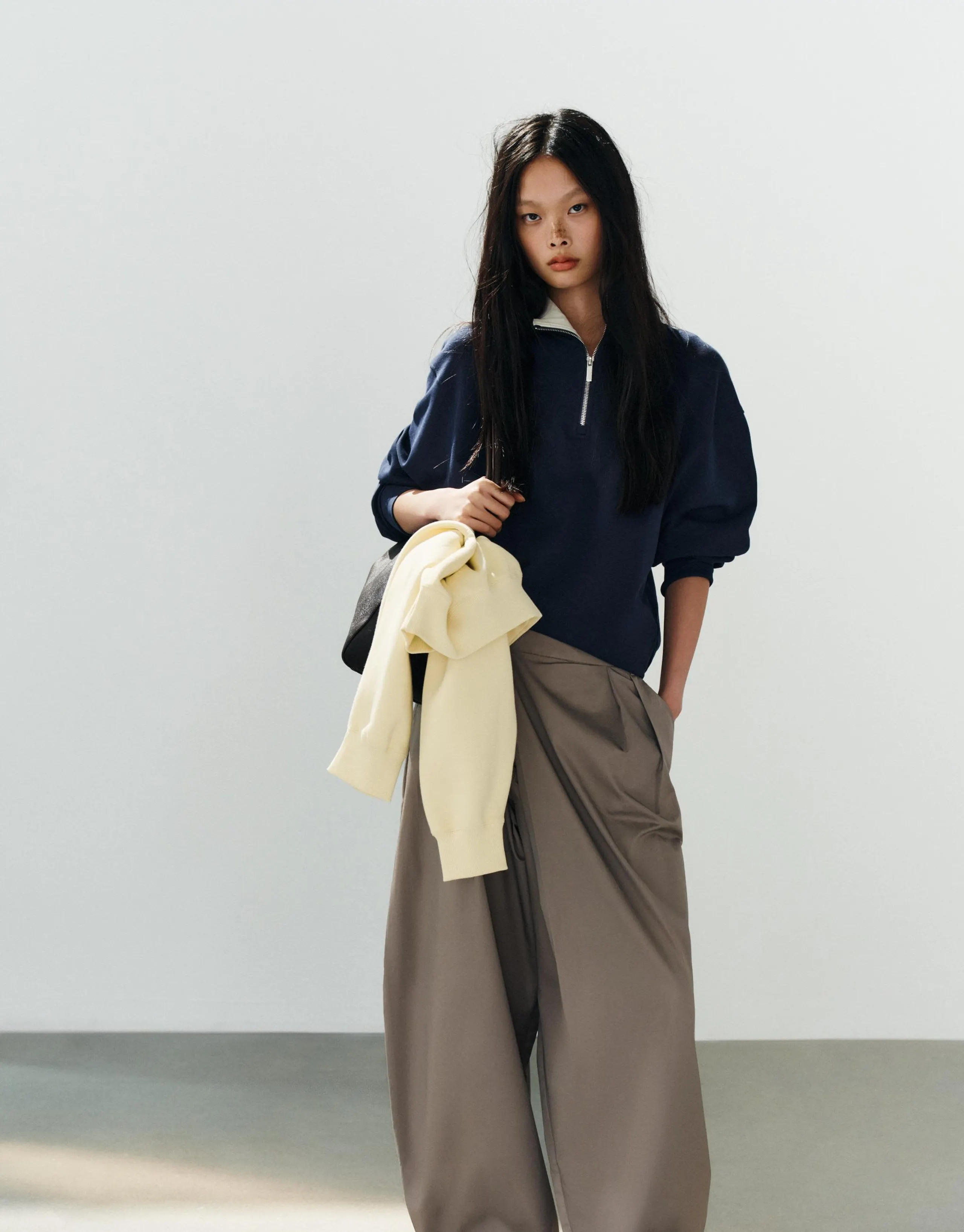ASYMMETRIC WAIST PLEATED TROUSERS