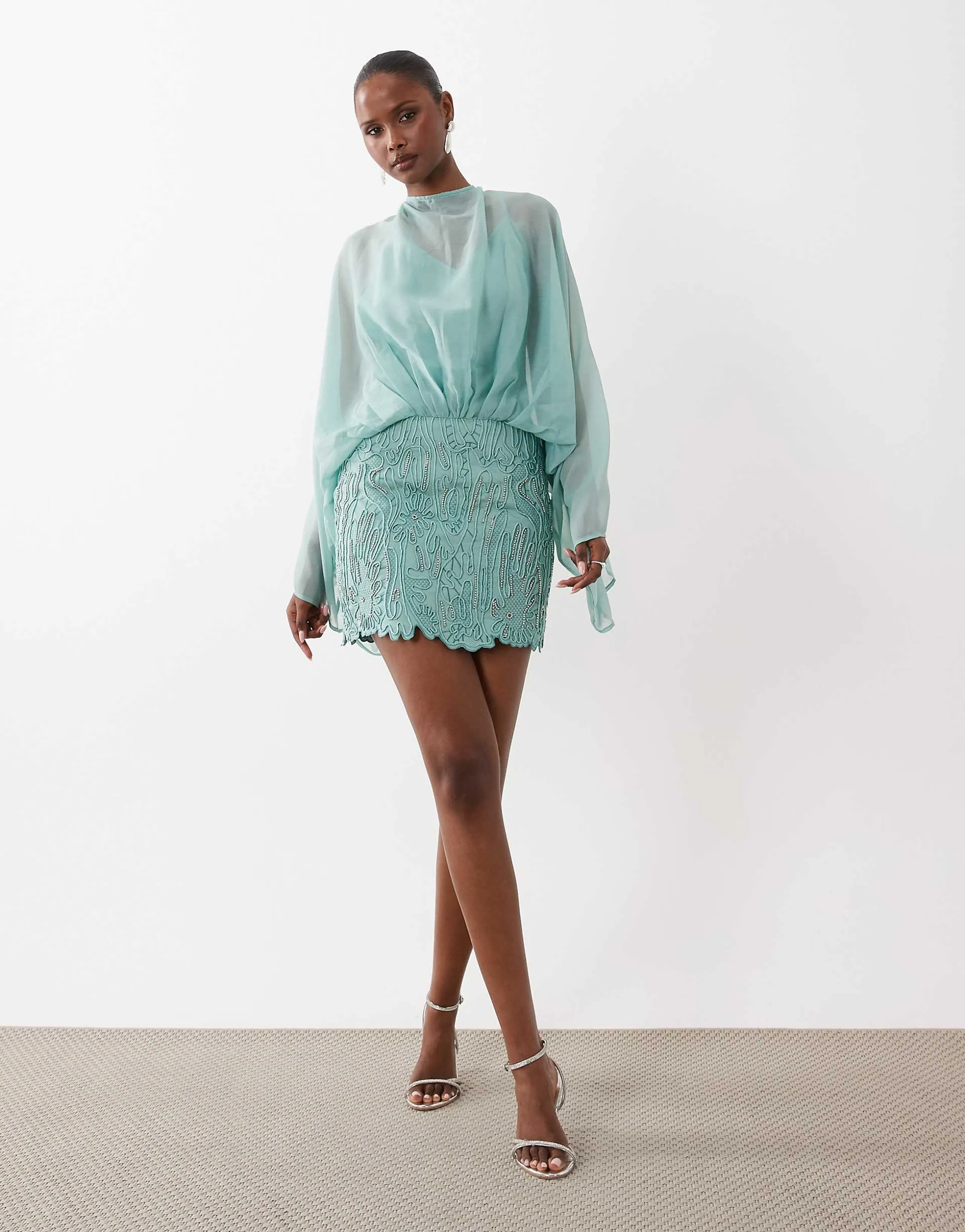 ASOS DESIGN Caped open back mini dress with embellished skirt in turquoise