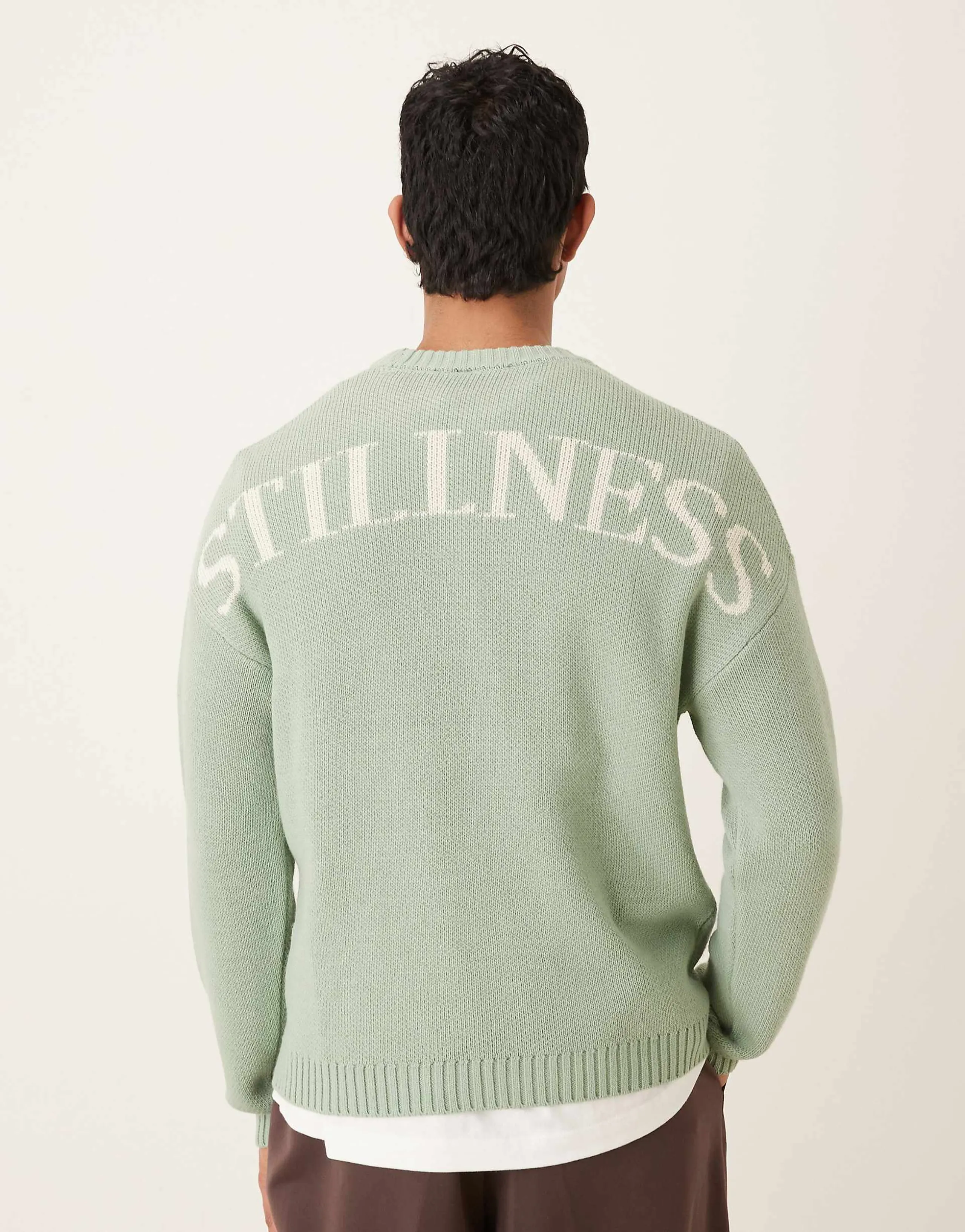 ASOS DESIGN oversized knitted sweater in sage with Stillness backprint