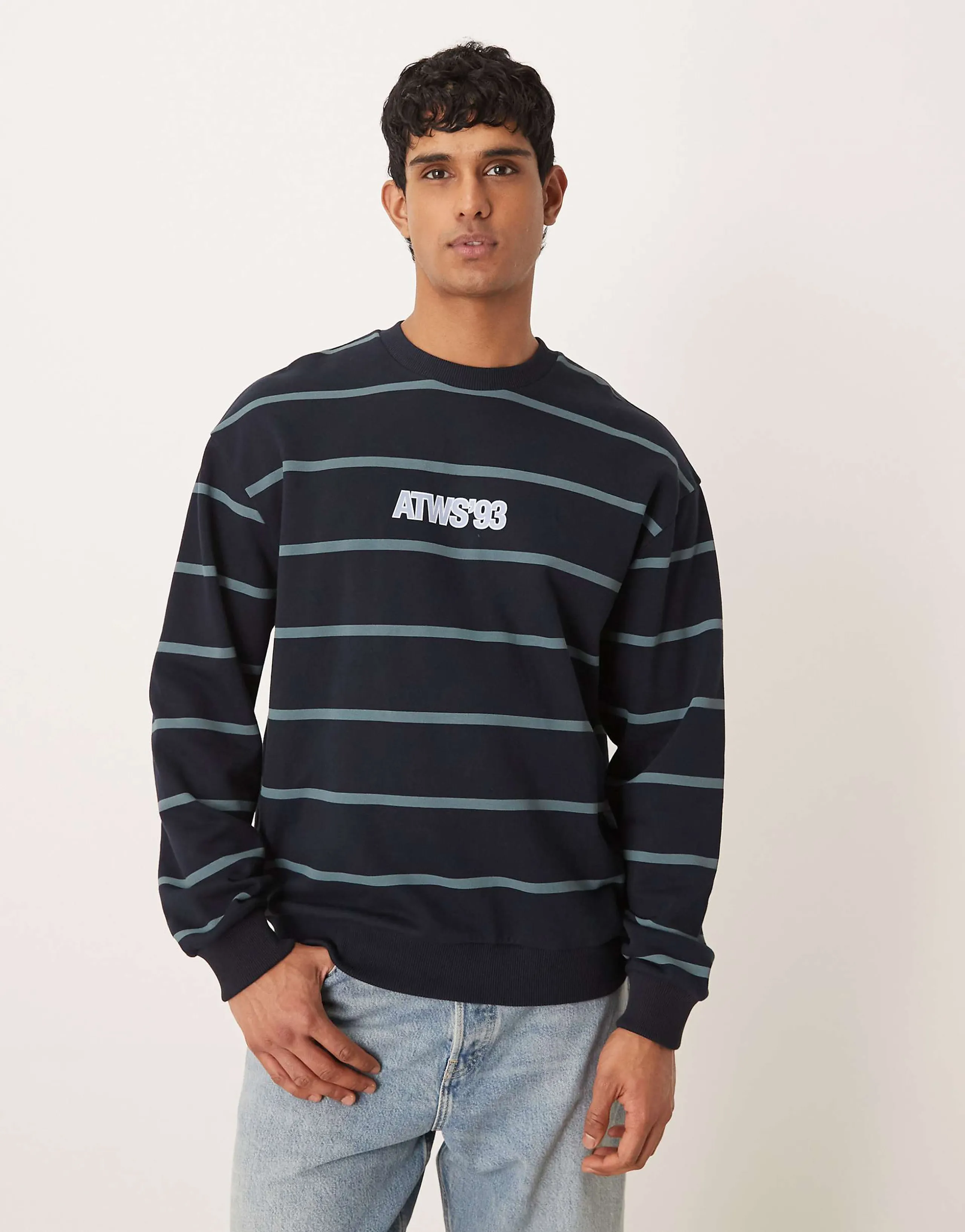 ASOS DESIGN relaxed fit stripe crew sweatshirt with text print in navy