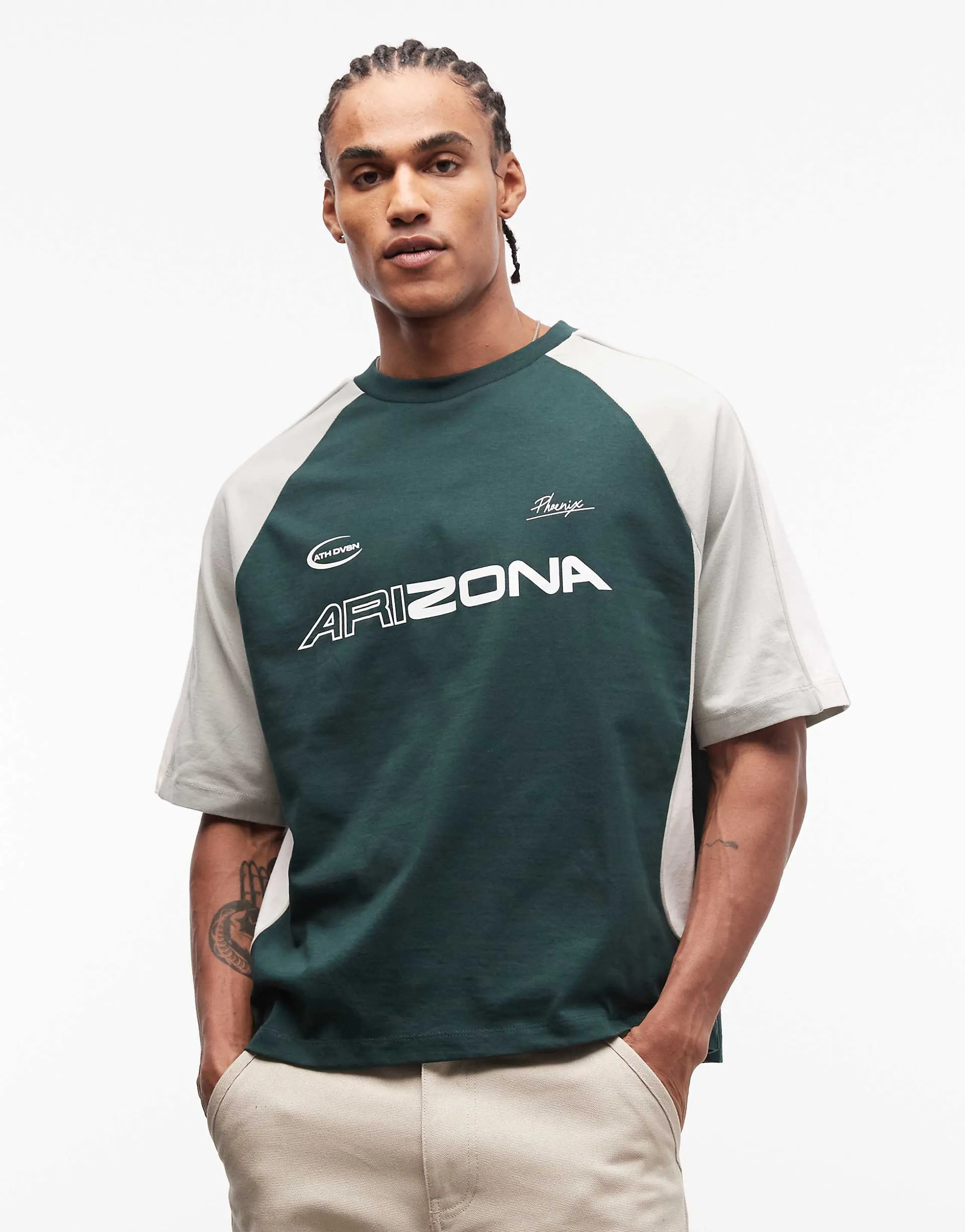 ASOS DESIGN boxy oversized t-shirt with cut and sew paneling and sports graphics in green