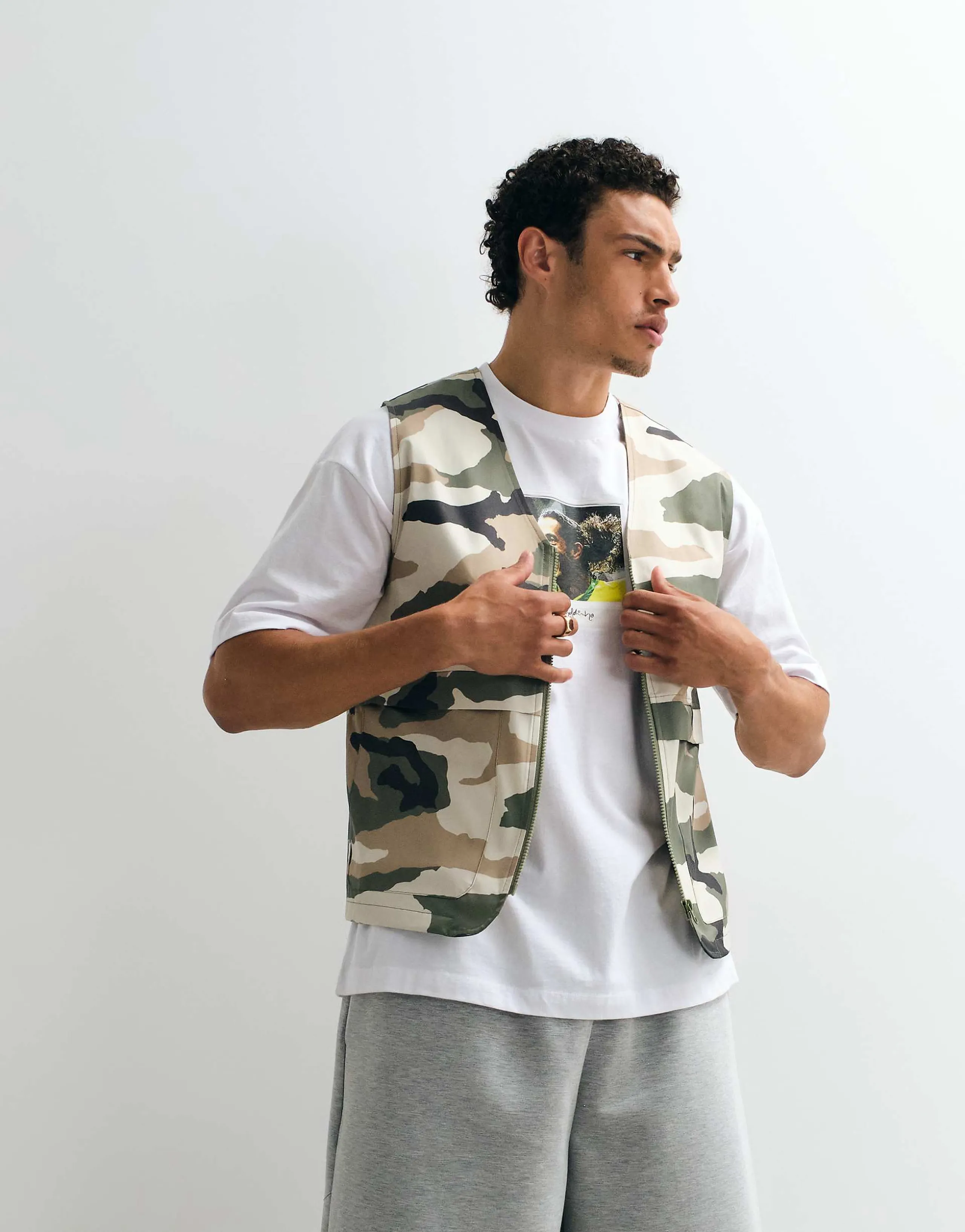 ASOS DESIGN stormMAX™ water repellent utility vest in camo