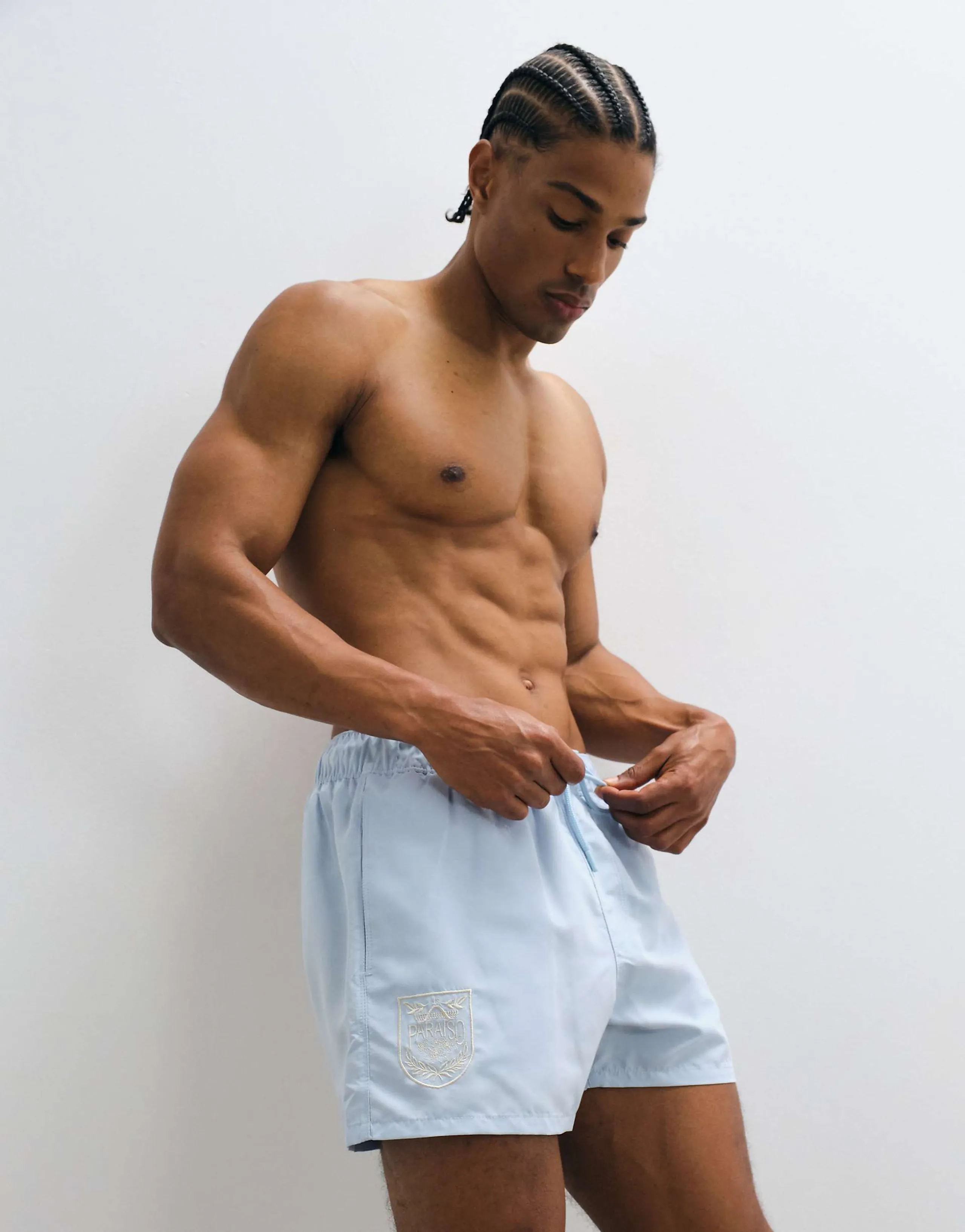 ASOS DESIGN swim shorts in short length with embroidery in blue