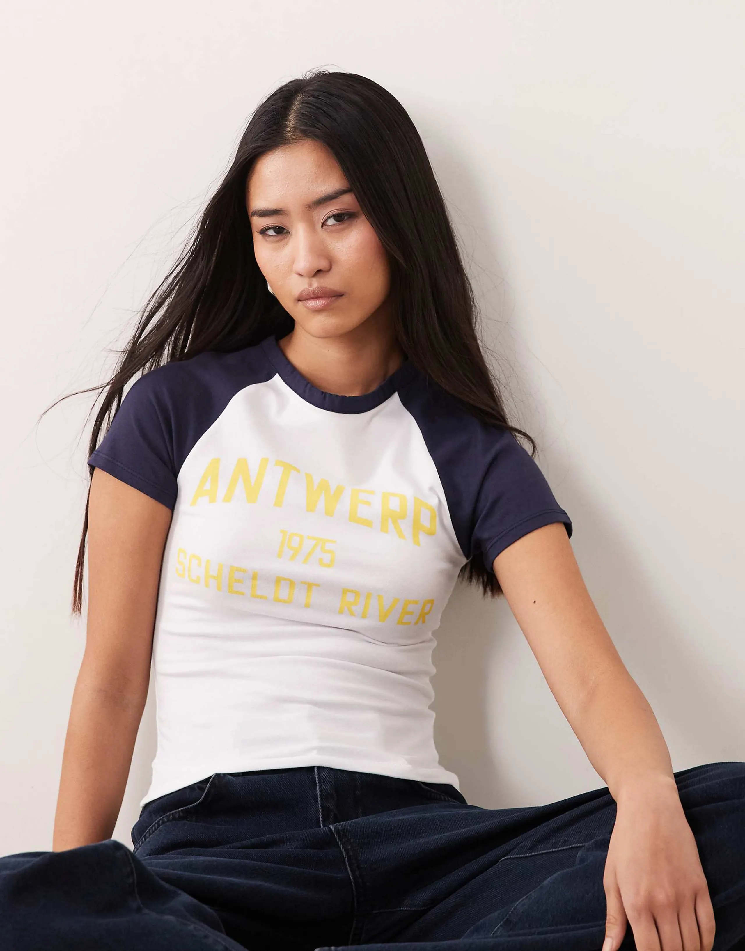 ASOS DESIGN Raglan baby tee with Antwerp location graphic in white and navy