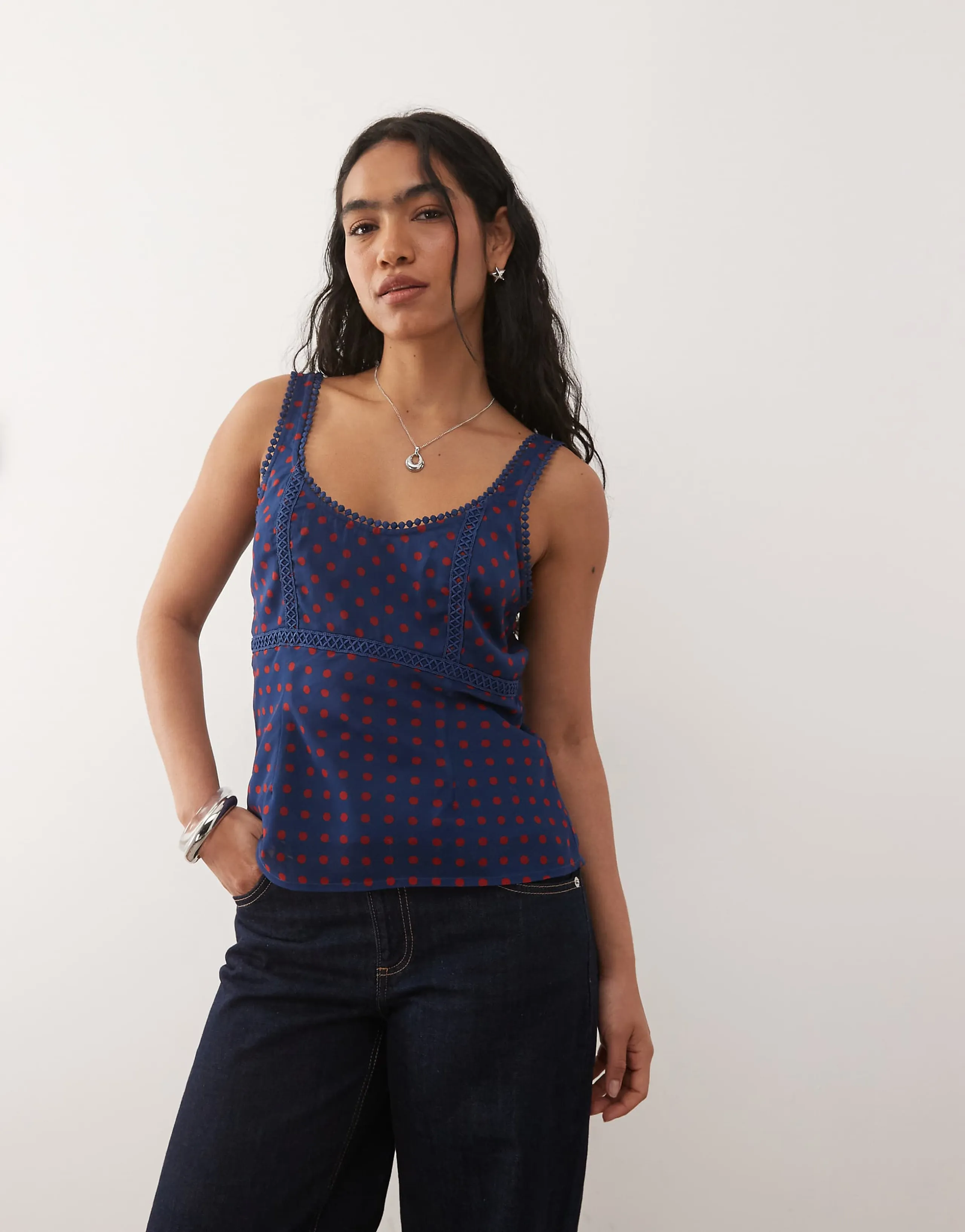 Reclaimed Vintage dressy cami top with lace trim in navy and red polka dot print