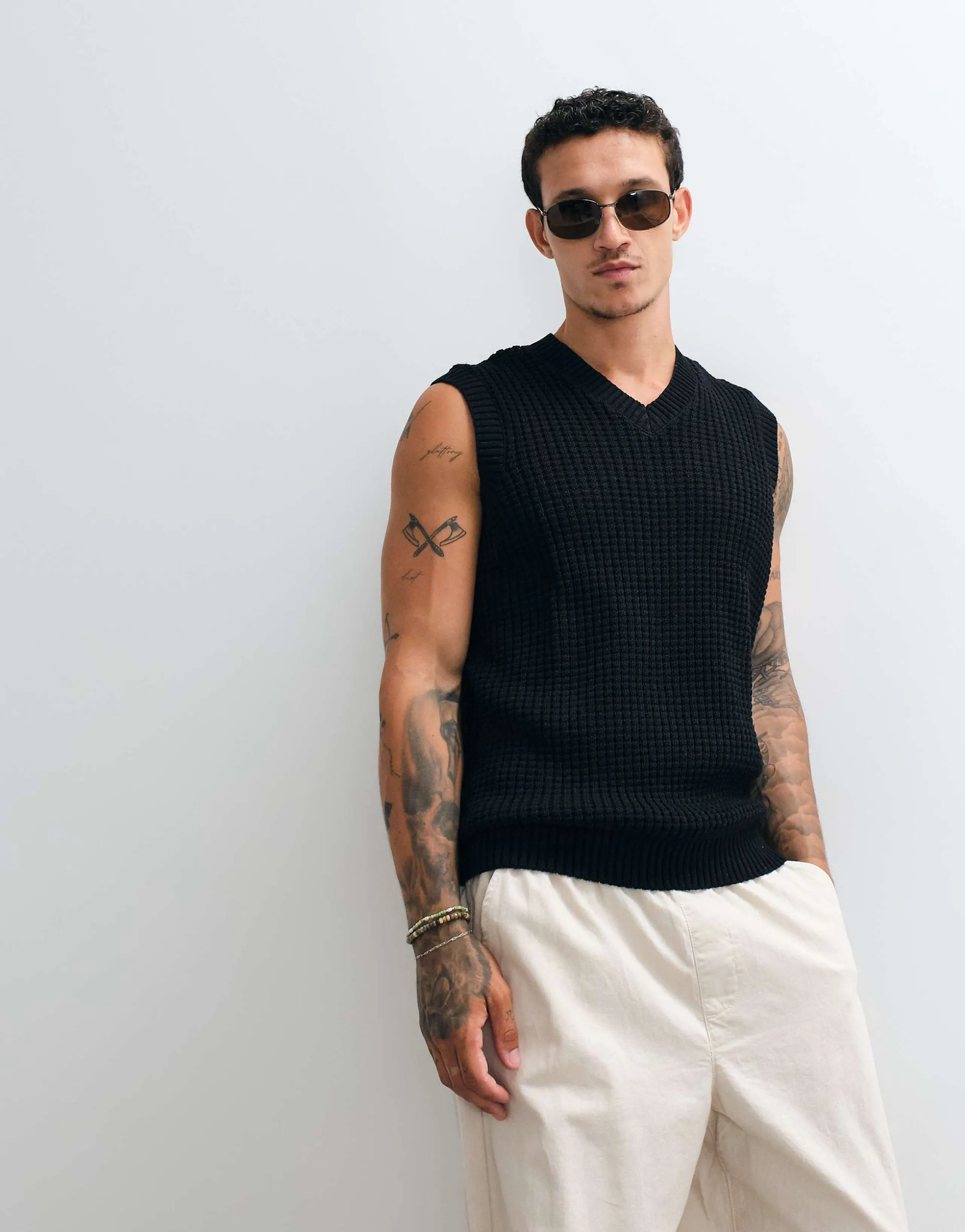 ASOS DESIGN relaxed textured waffle knit vest in black
