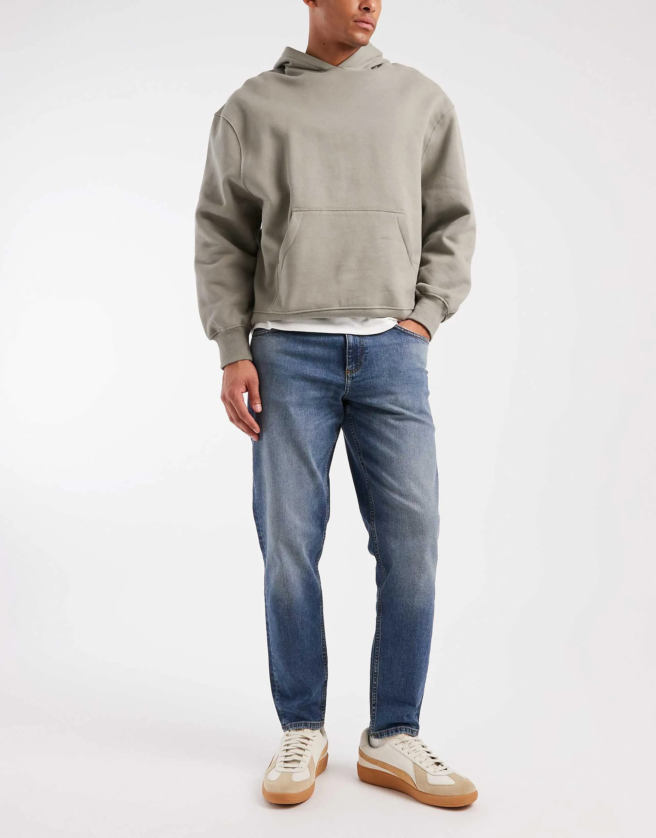 ASOS DESIGN tapered jeans in mid wash blue with tint