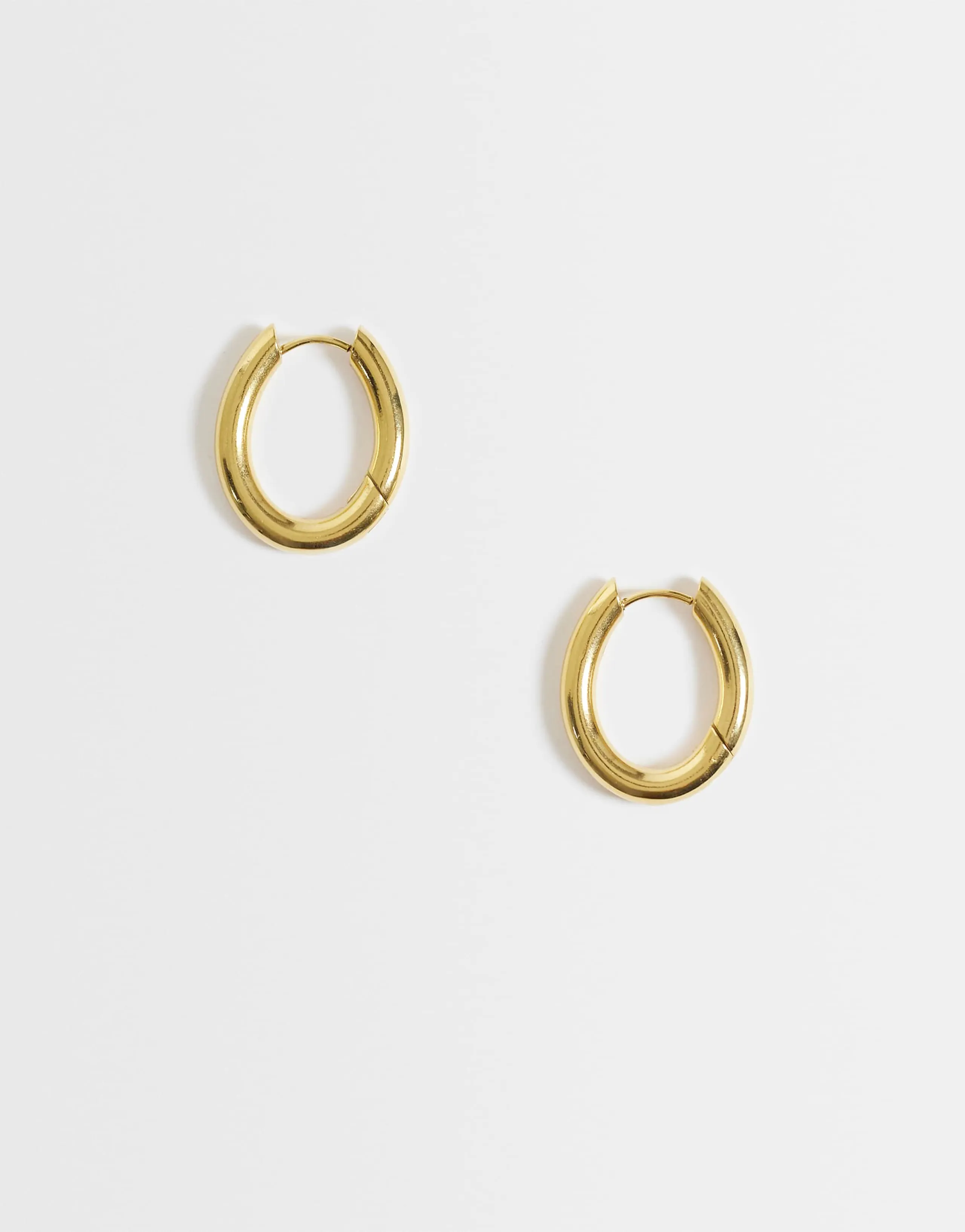 Lost Souls oval huggie hoop earrings in 18kt gold-plated stainless steel