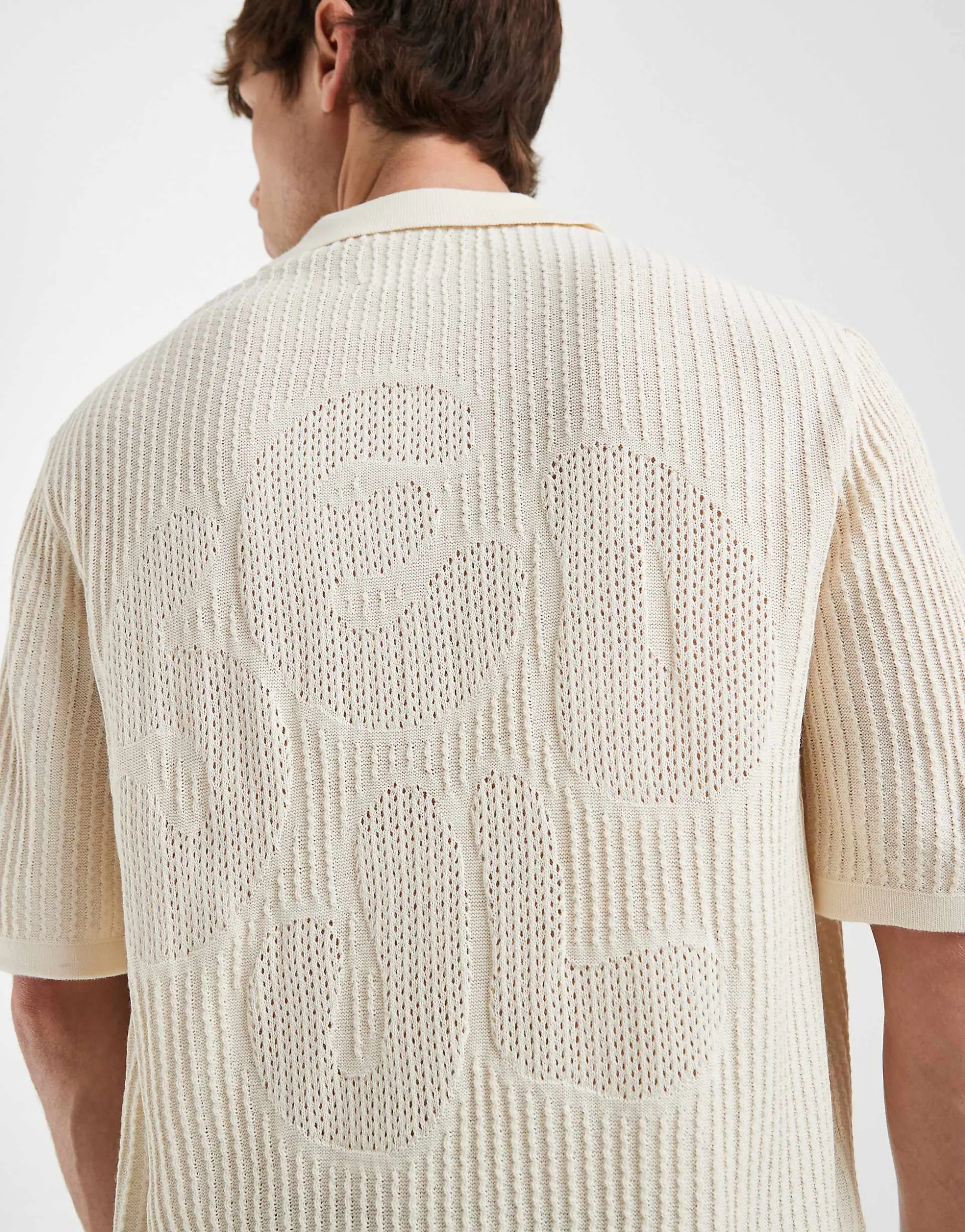 ASOS DESIGN oversized knit short sleeve crochet notch neck polo shirt with Seoul embroidery in stone