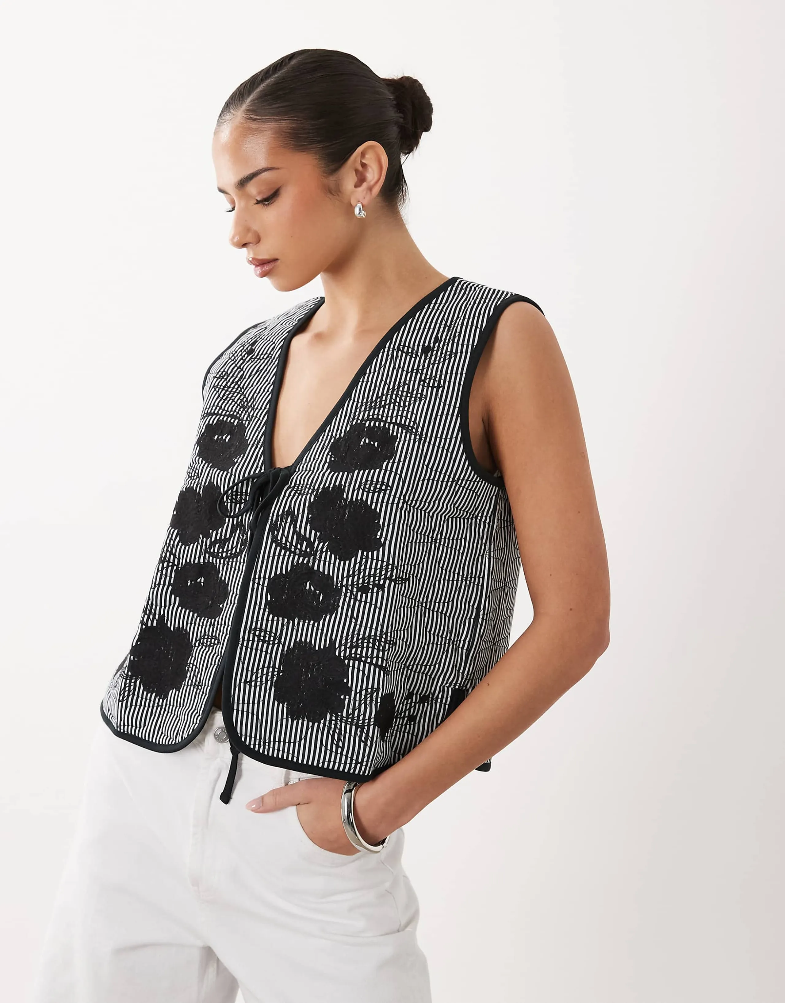 ASOS DESIGN quilted striped vest with embroidered floral design in black and white