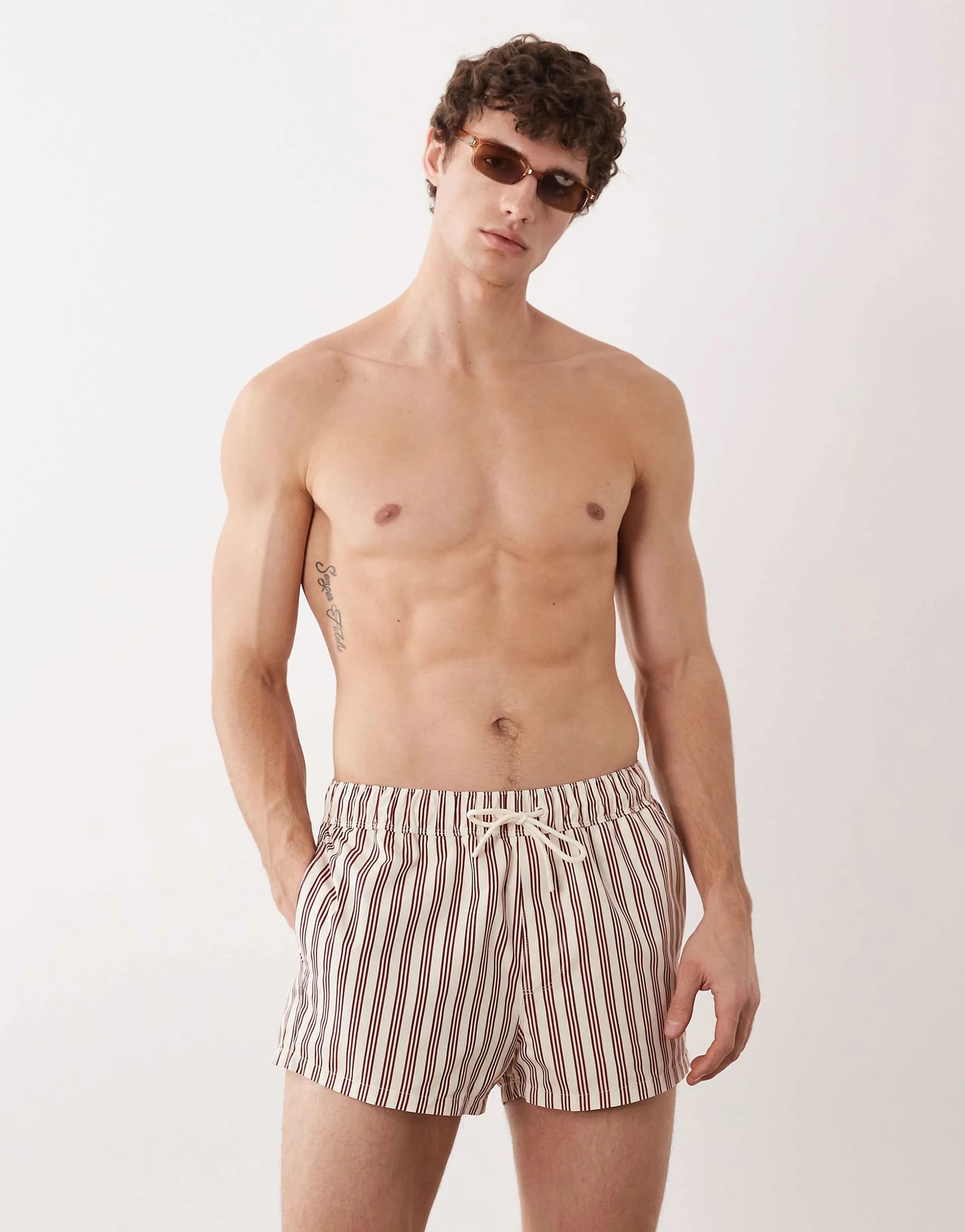 ASOS DESIGN swim shorts in super short length in cream and burgundy stripe