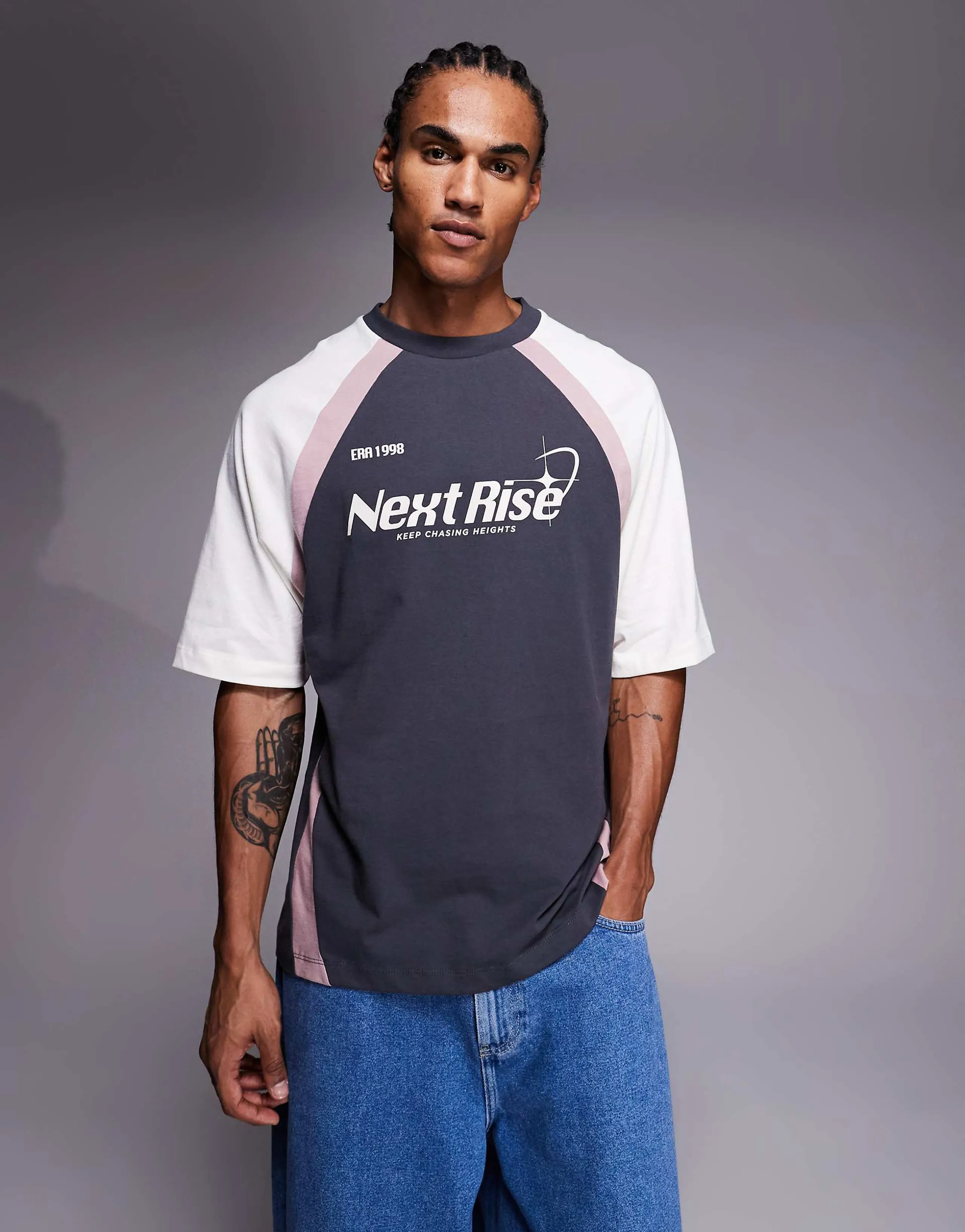 ASOS DESIGN oversized T-shirt with cut and sew paneling and sports graphic in charcoal