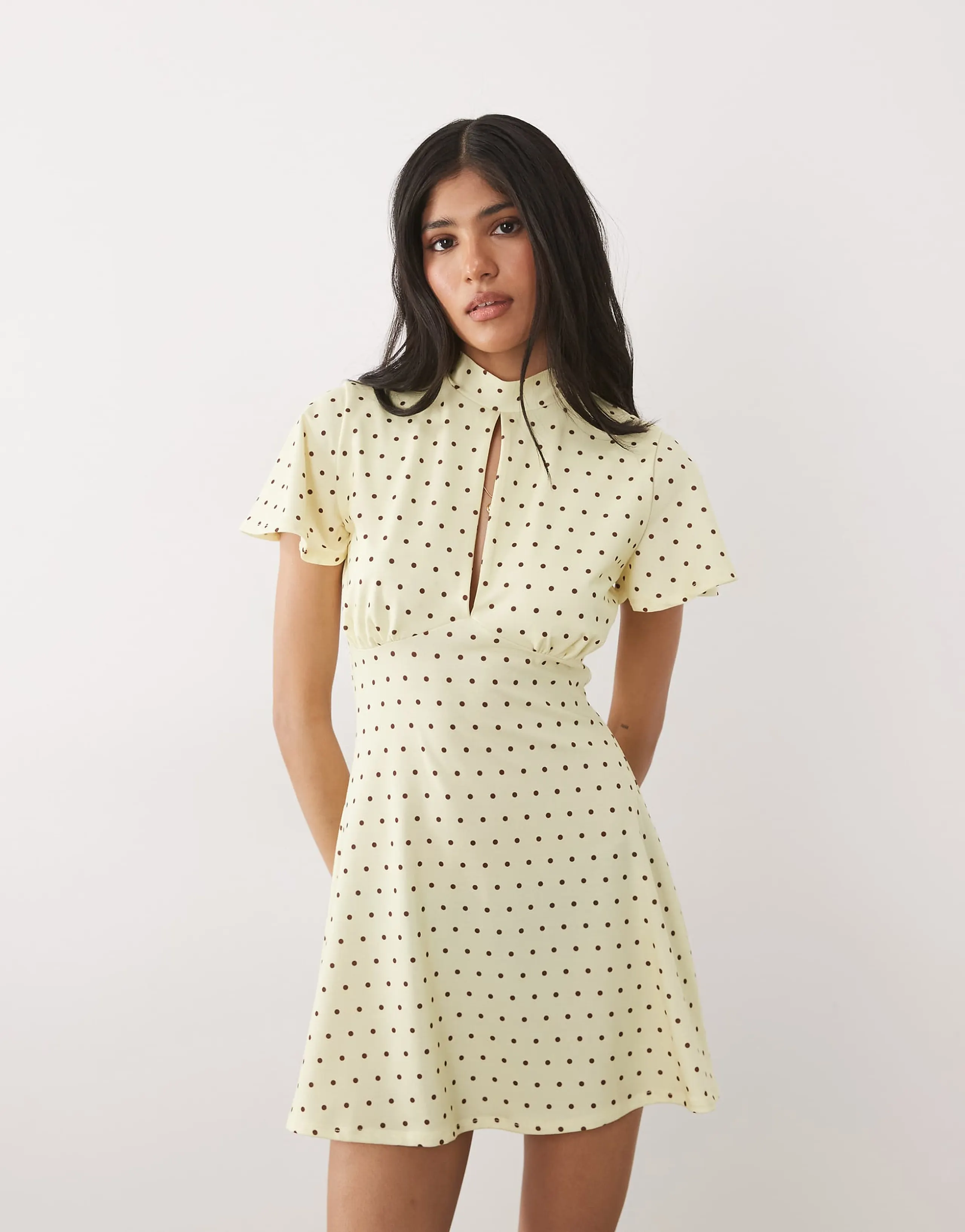 ASOS DESIGN cap sleeve mini dress with tie detail in buttermilk and brown polka-dot print