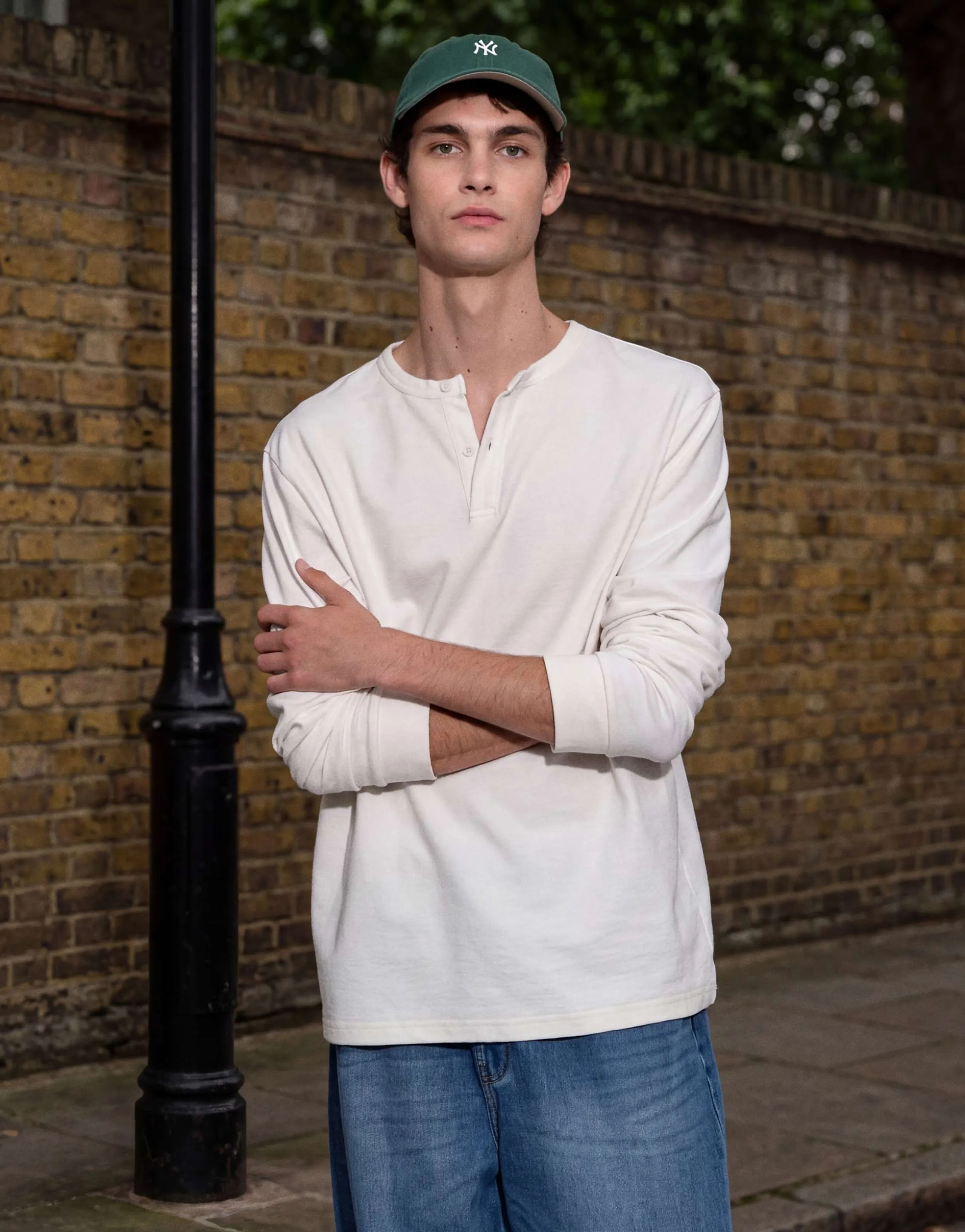 ASOS DESIGN regular fit long sleeve T-shirt with henley neck in cream texture