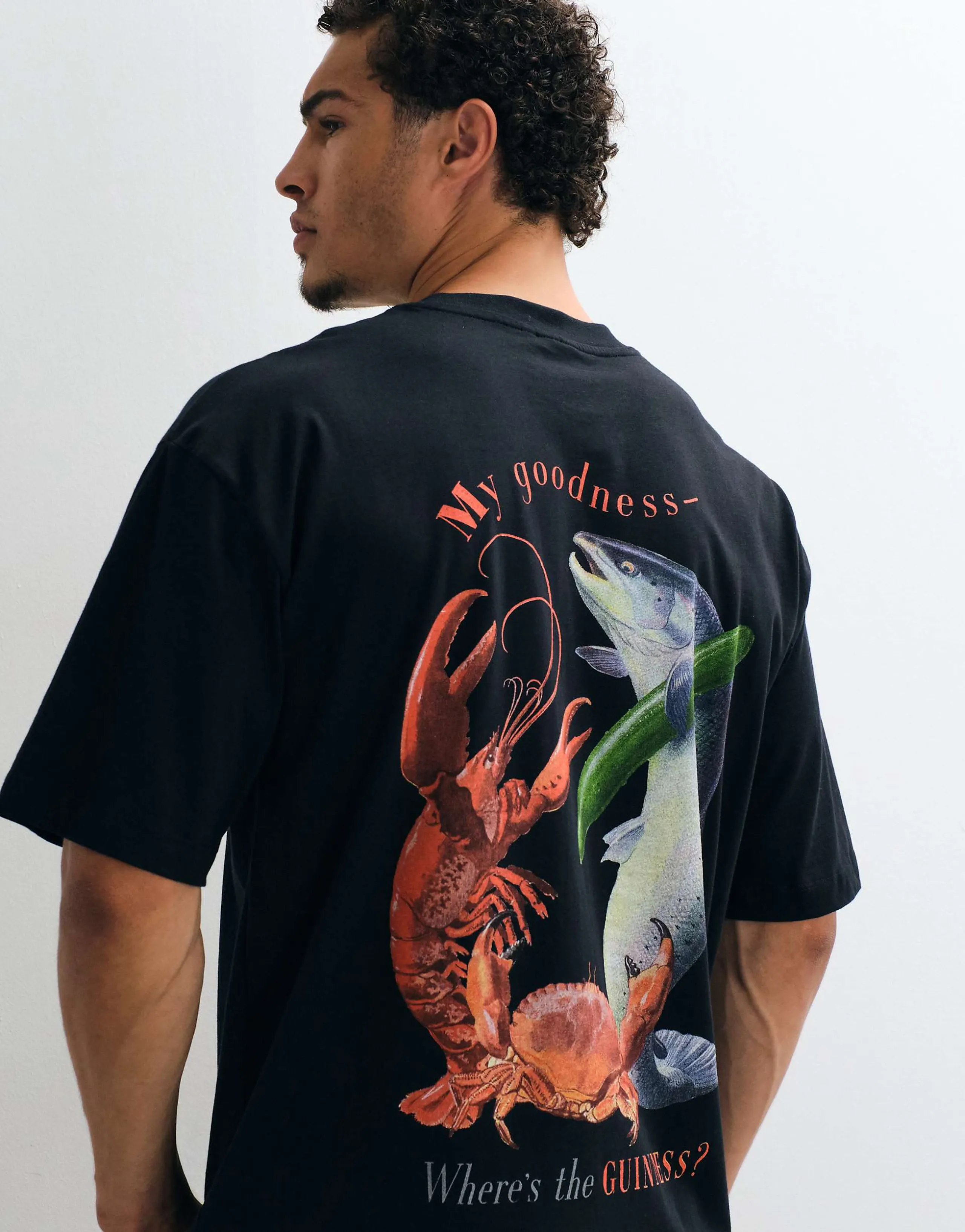 ASOS DESIGN oversized tee with Guinness print in Black