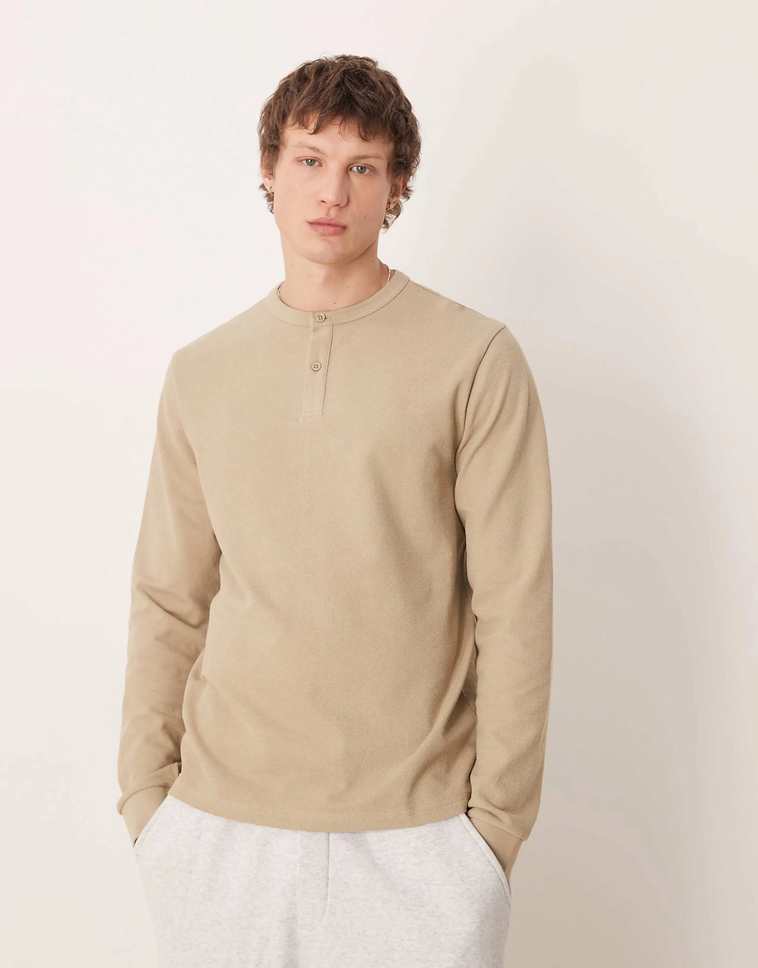 ASOS DESIGN regular fit long sleeve T-shirt with henley neck in beige texture