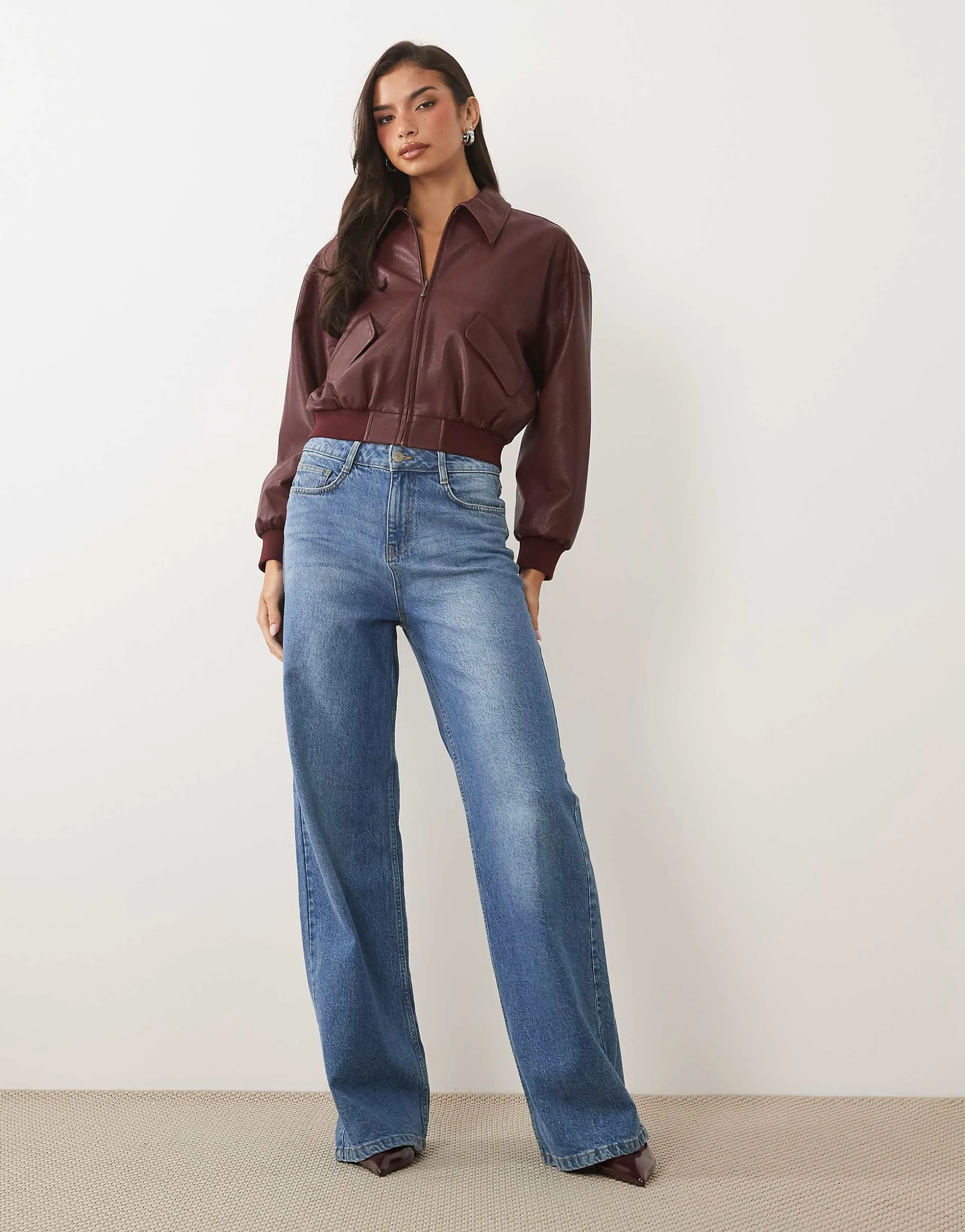Good American faux leather cropped bomber jacket in burgundy